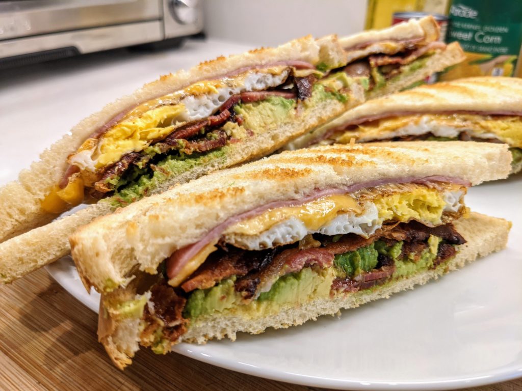 Egg, Ham, Cheese, Bacon and Avocado breakfast sandwich