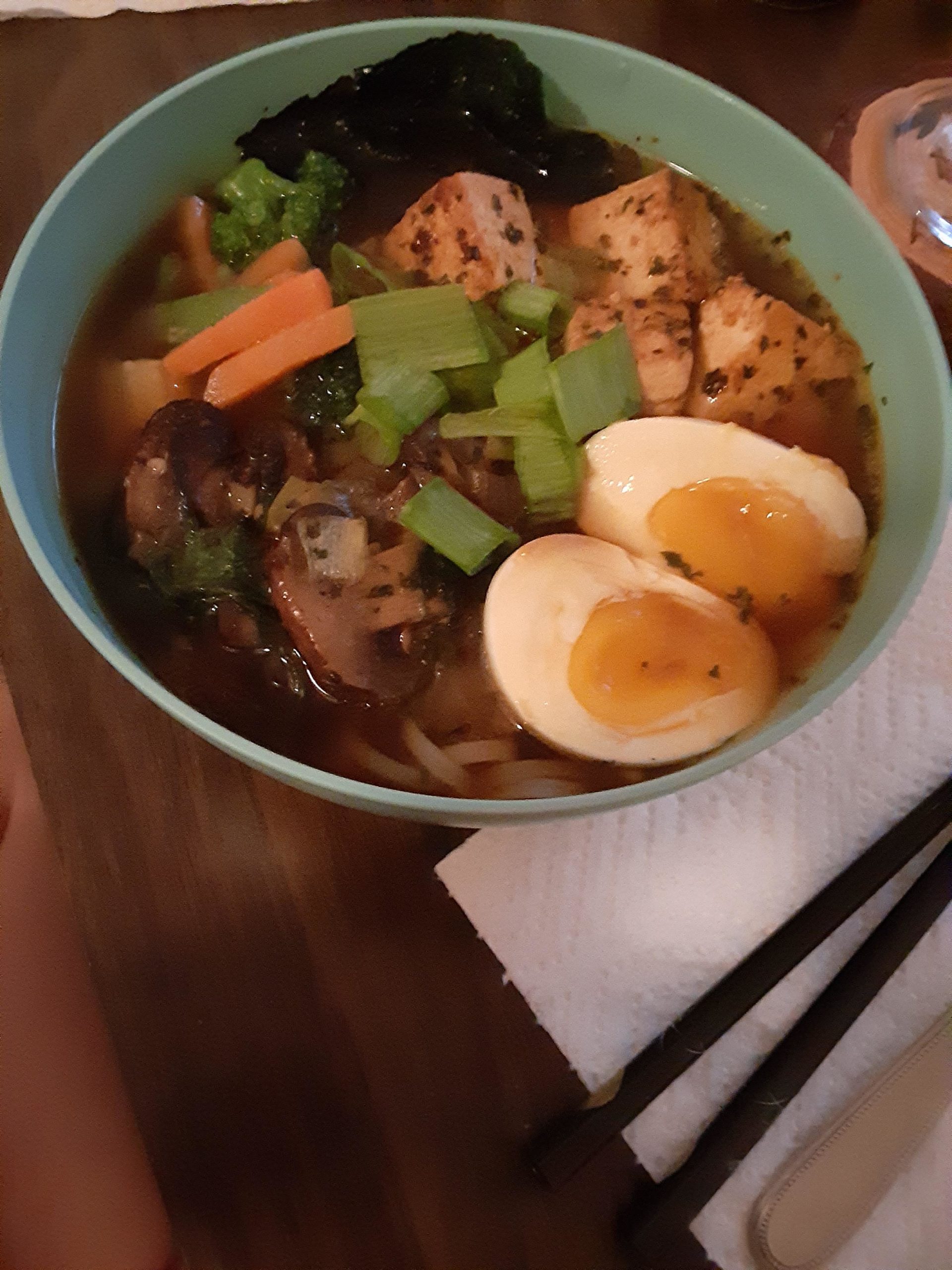 Homemade rice noodle soup with miso broth, soft boiled eggs, tofu
