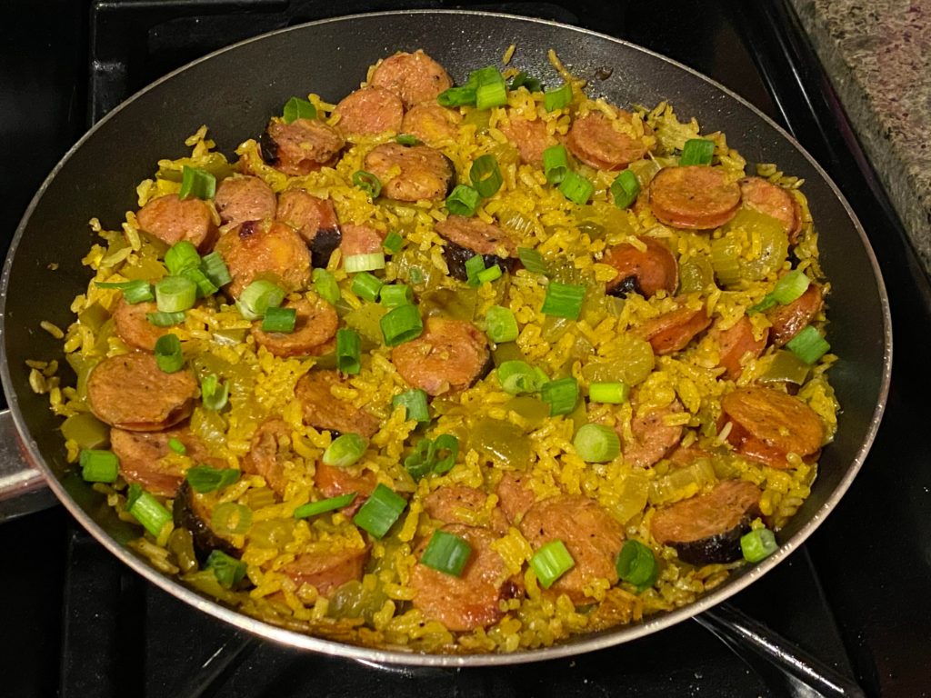 Chicken Apple Sausage & rice skillet with bell peppers and celery, simmered in chicken bone broth + spices