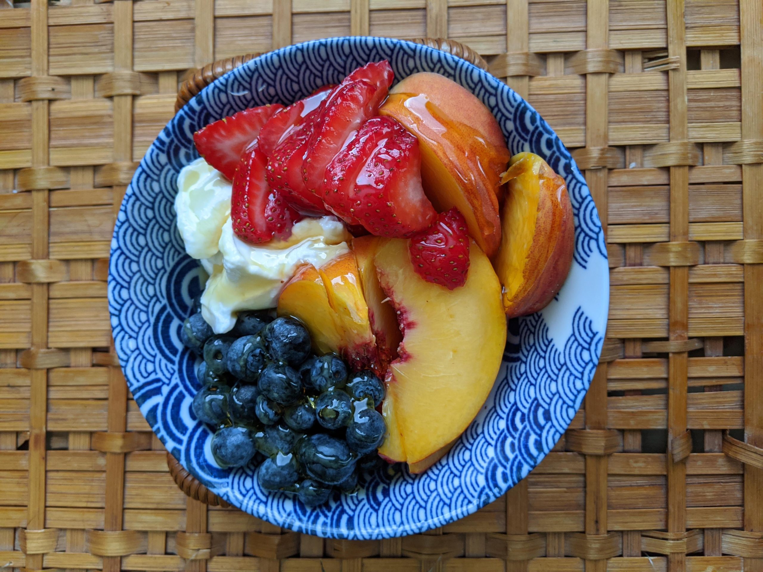 Summer in a bowl whole Greek yogurt with blueberries, strawberries