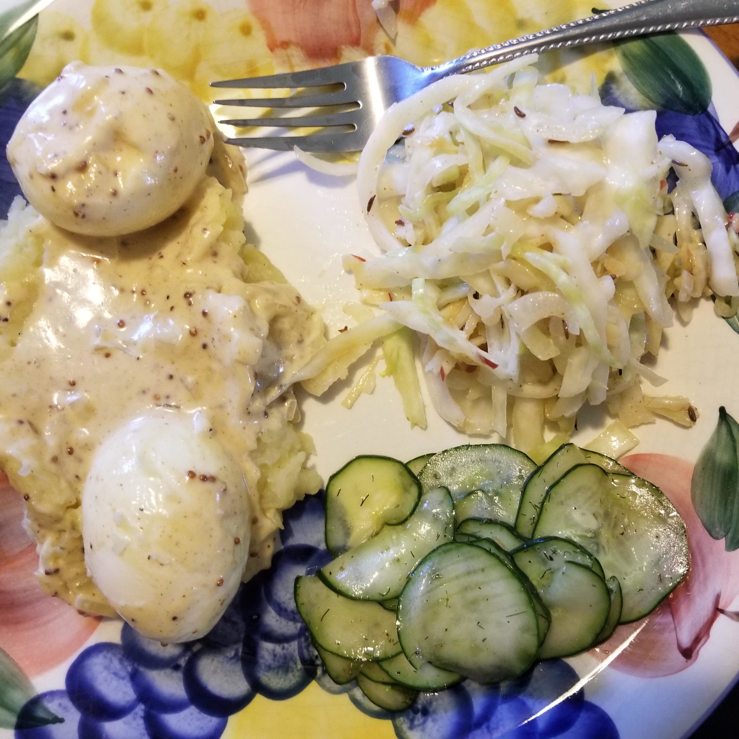 Eggs in mustard sauce over mashed potatoes (Senfeier) with (german