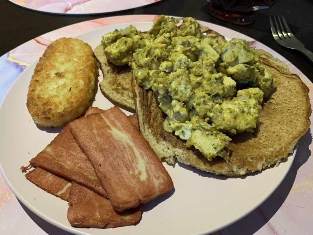 Pancakes, hash brown, scrambled tofu and vegan bacon!