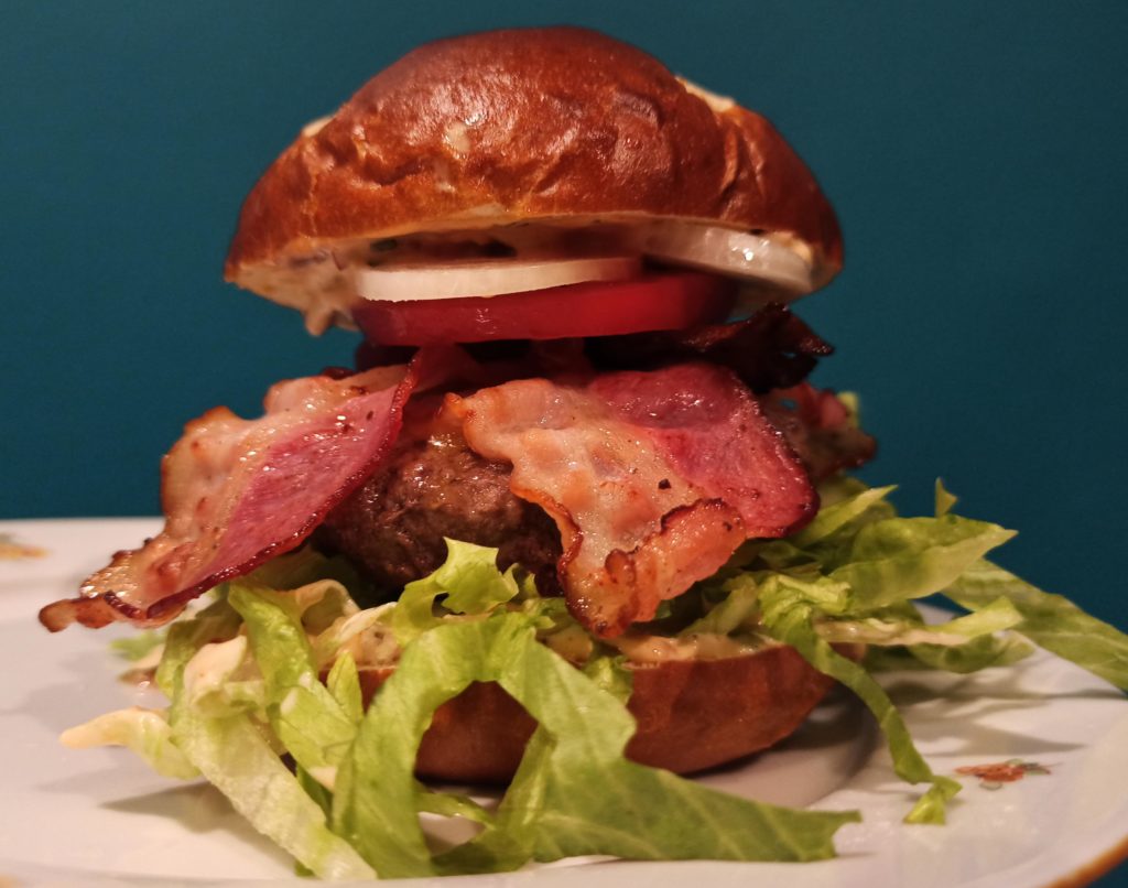 BLT burger in a pretzel bun