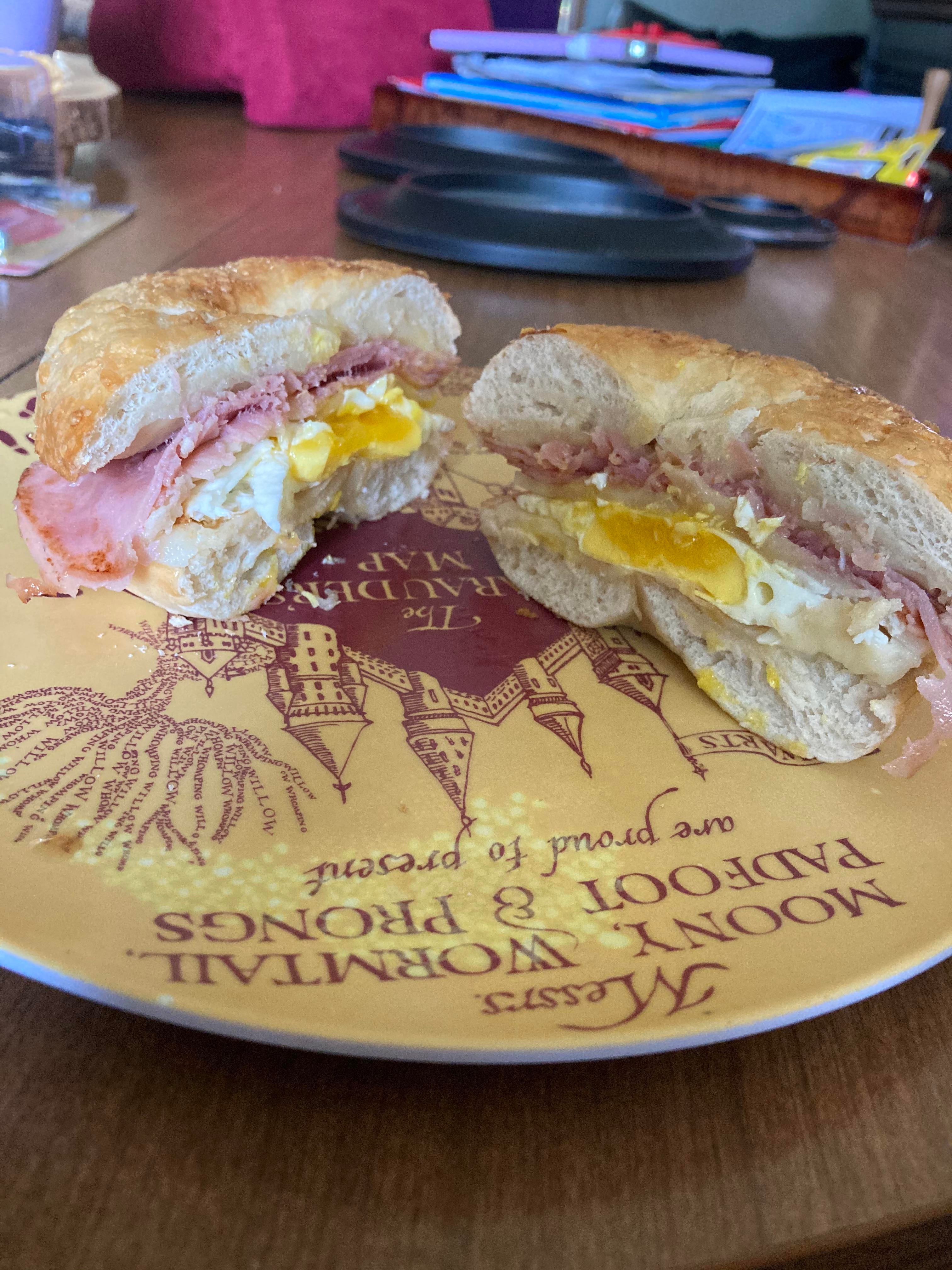 Asiago bagel with a fried egg, ham and provolone cheese Dining and