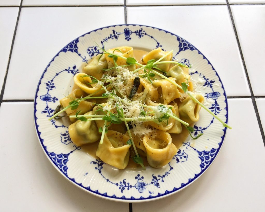Homemade cappelletti pasta filled with spinach, lemon zest and ricotta in a brown butter/sage sauce