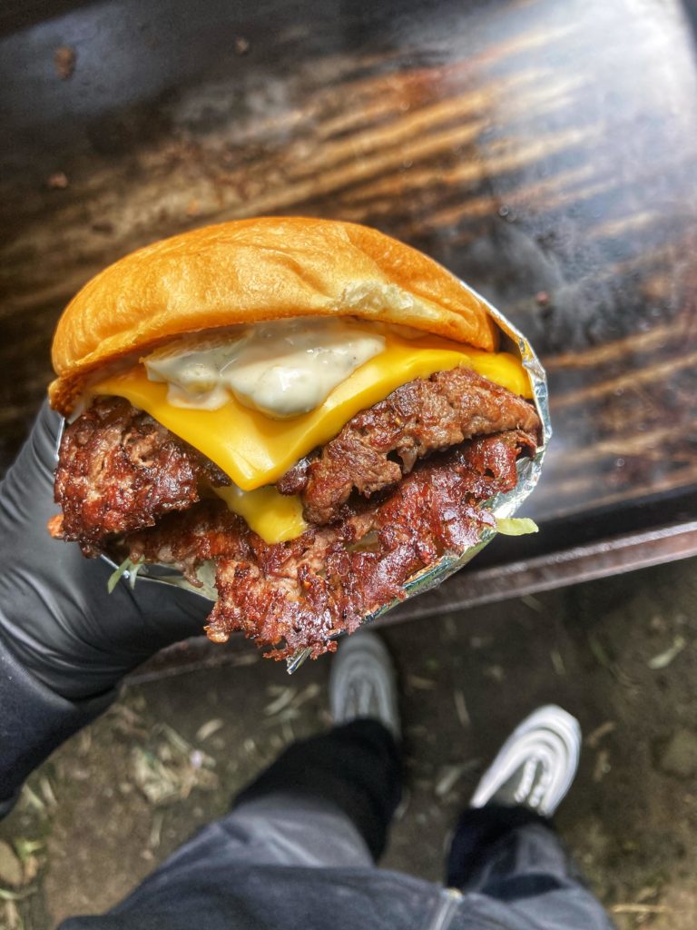 Double cheeseburger with lettuce, bacon onion jam, and jalapeño & pickle mayo