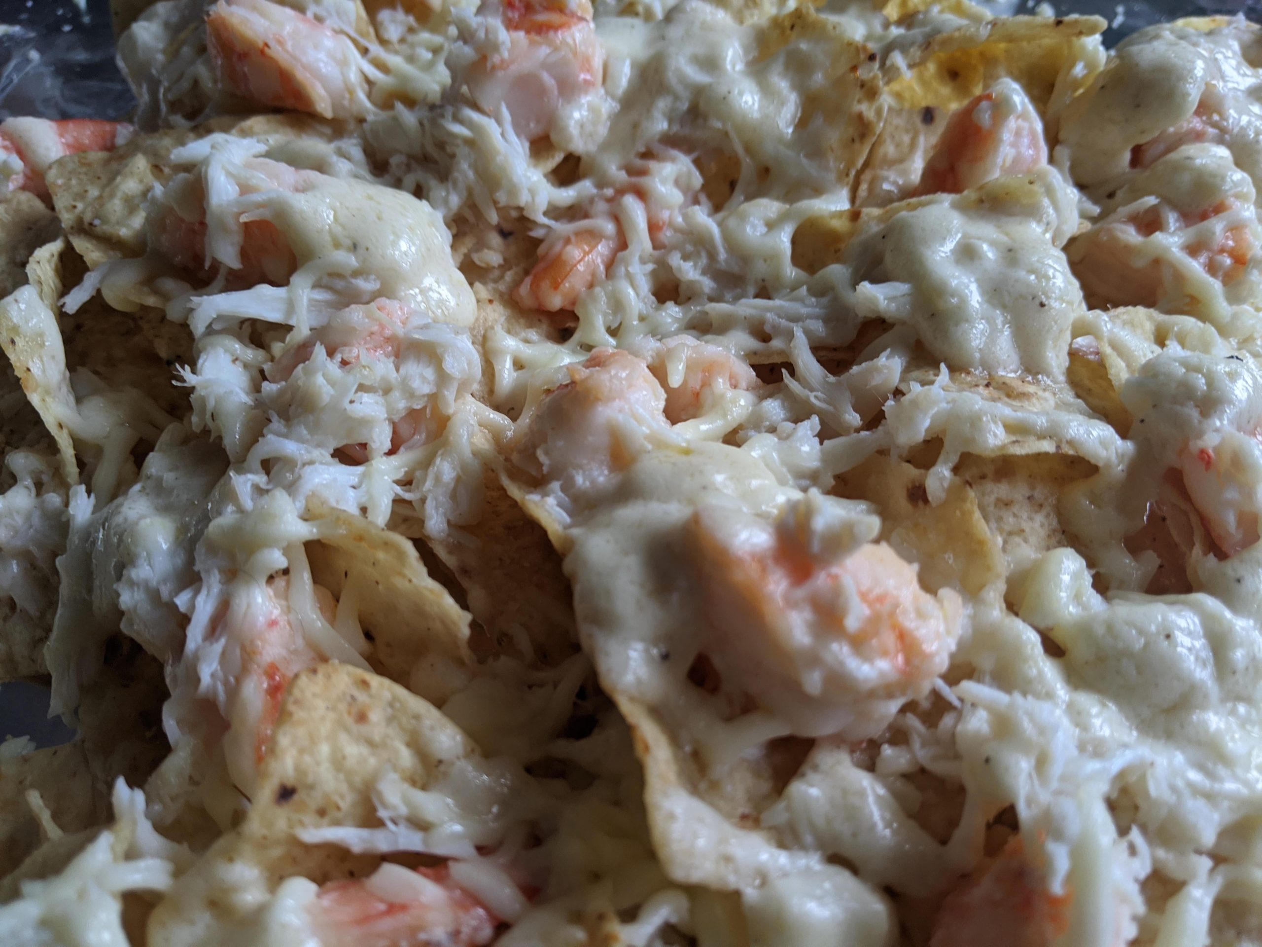 Shrimp and crab nachos with lemon garlic cream sauce Dining and Cooking