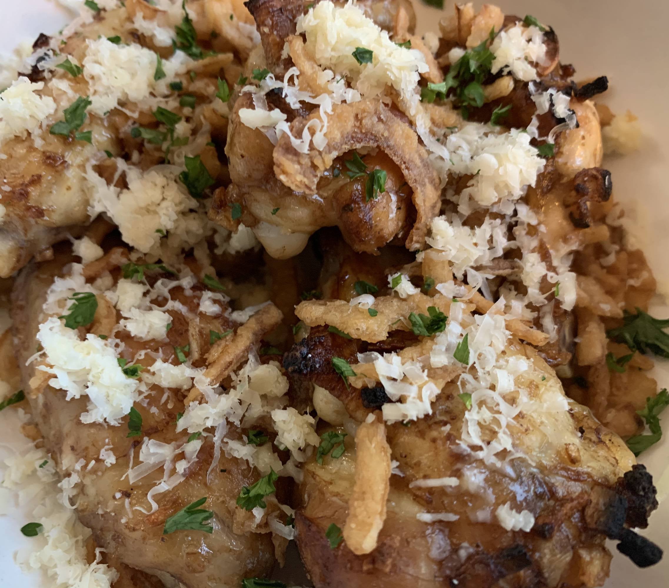 French onion chicken wings topped with freshly grated gruyere and