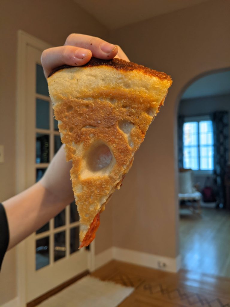 Why does my pan pizza have these giant bubbles in the bottom crust?