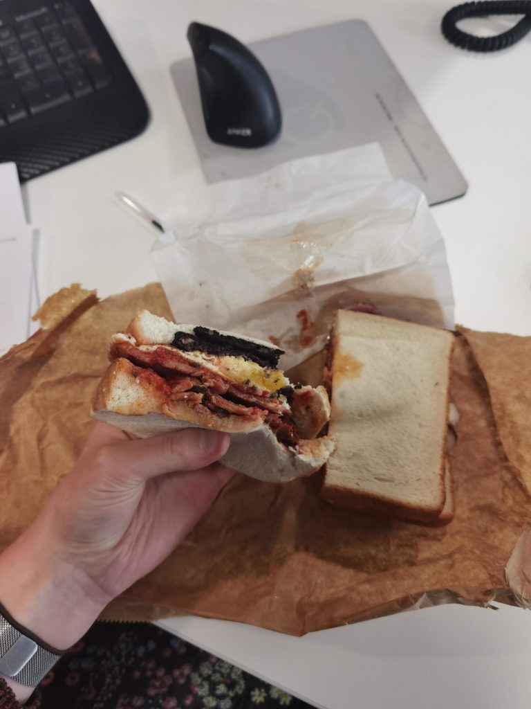 Fresh tomato, black pudding, fried egg and bacon on doorstop bread - Friday morning treat