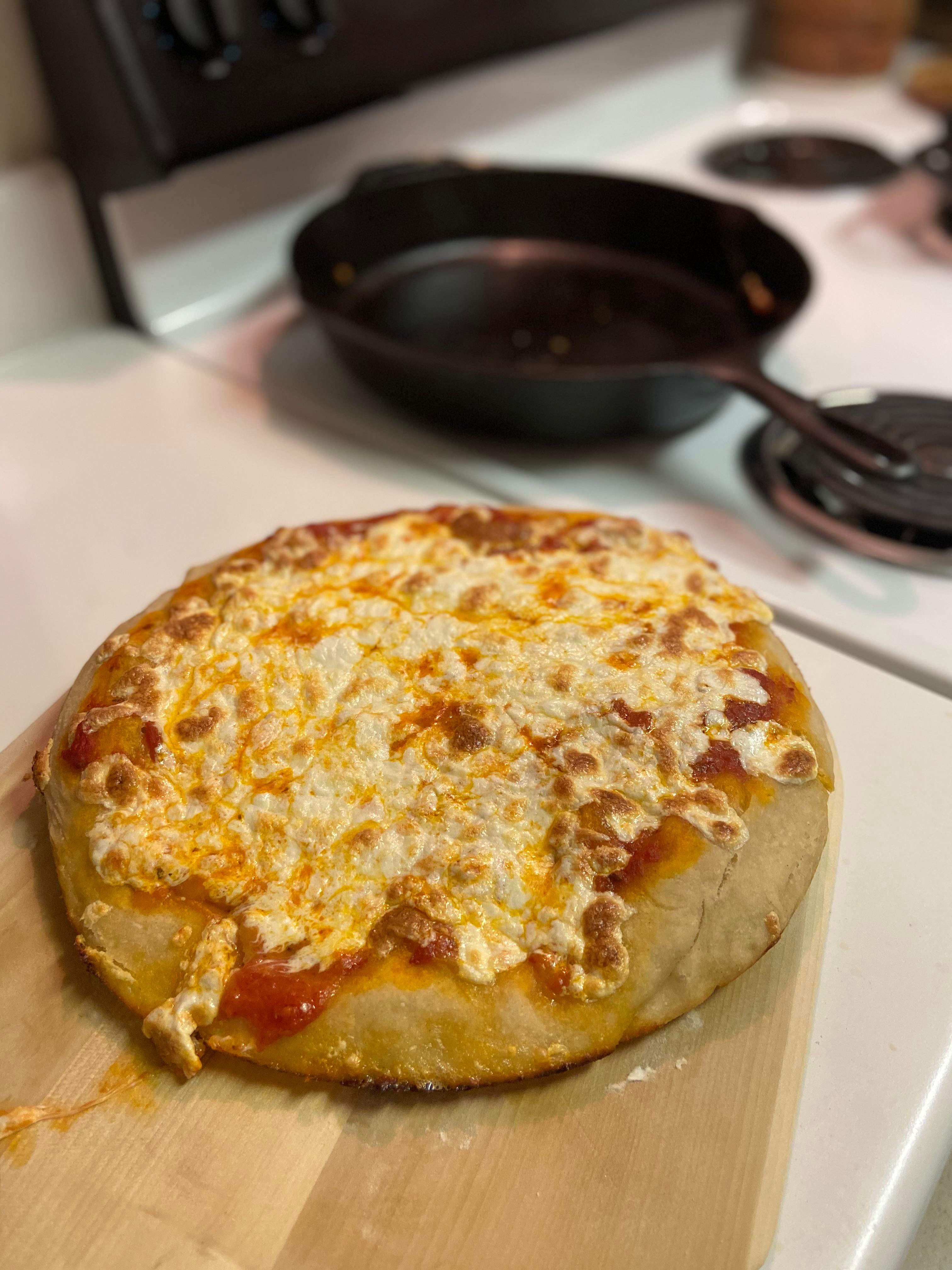Cast Iron Pan Cheese pizza courtesy of binging with babish Dining and