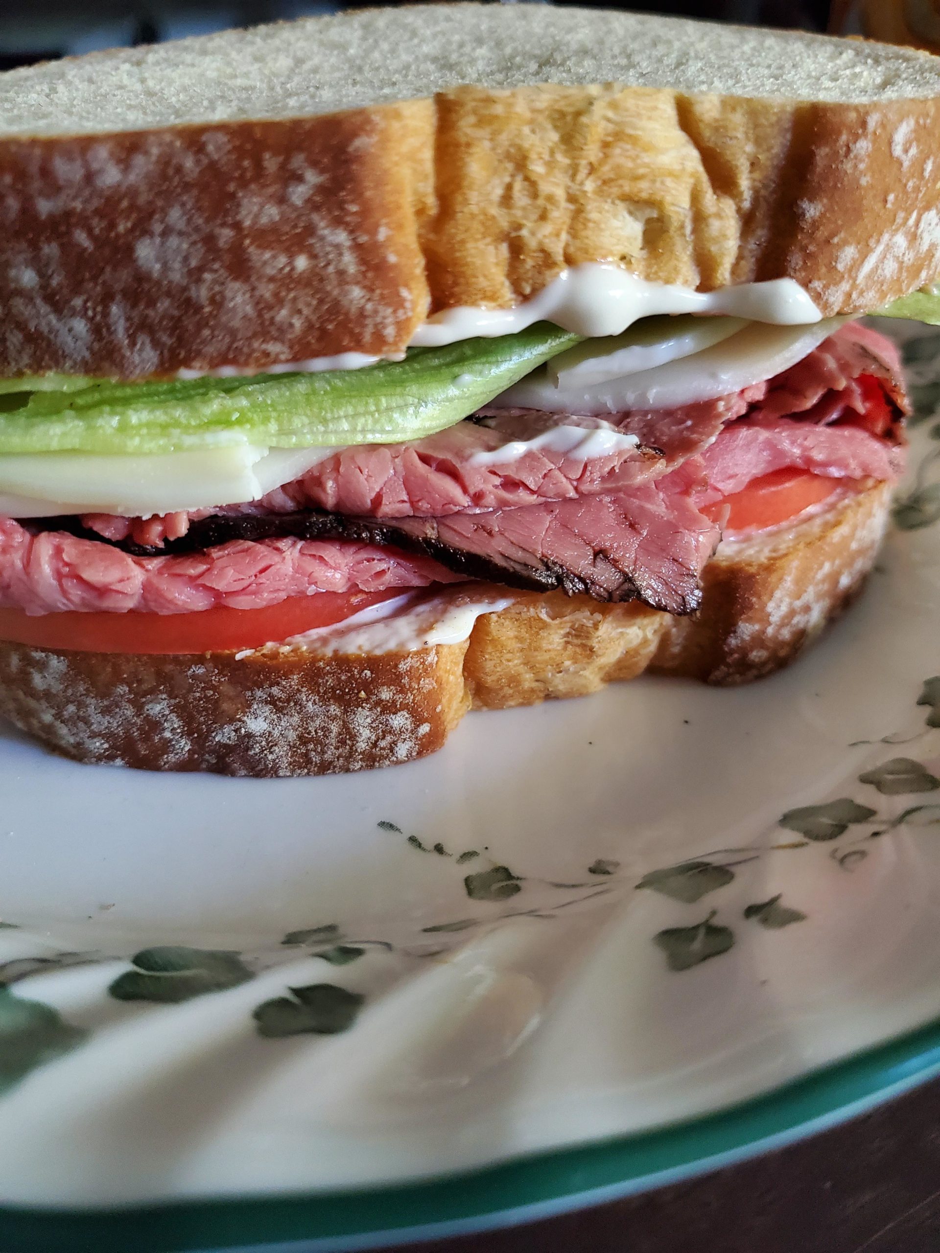 Roast beef, provolone, lettuce, tomato and horseradish mayo on white
