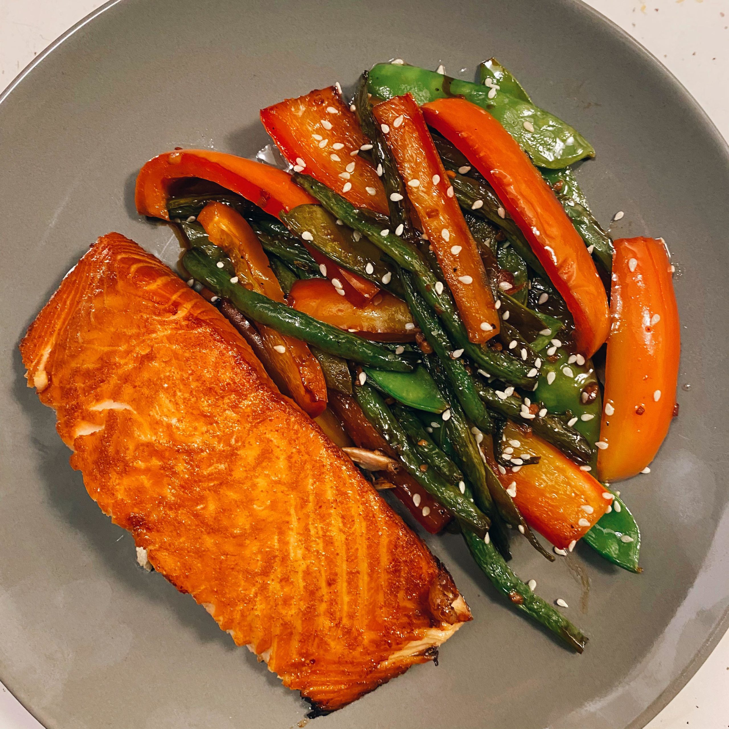 Brown sugar and soy sauce marinated salmon with sautéed veggies 🥢