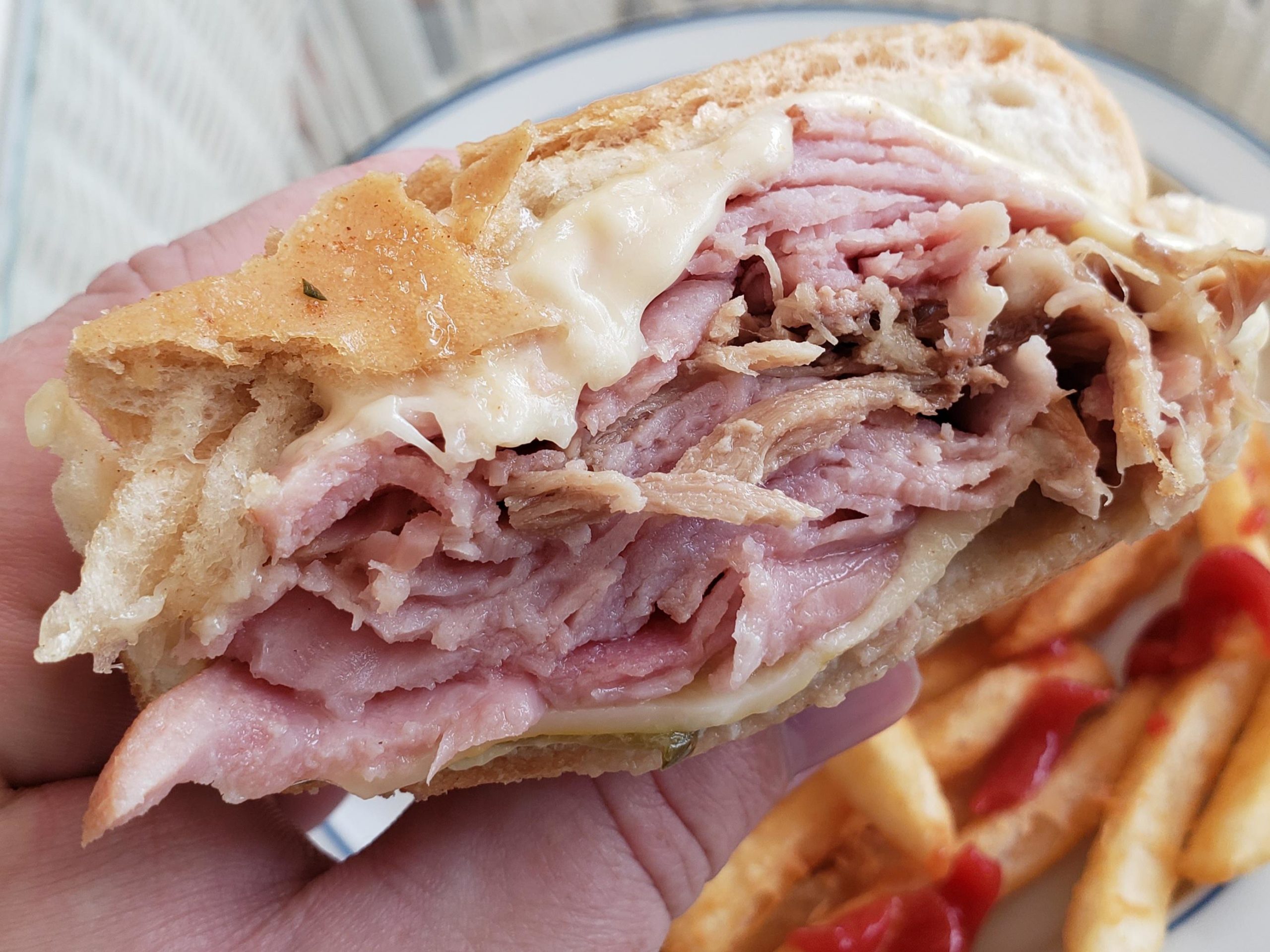 melted swiss, ham, shredded pork, mustard, pickles. classic Cuban from