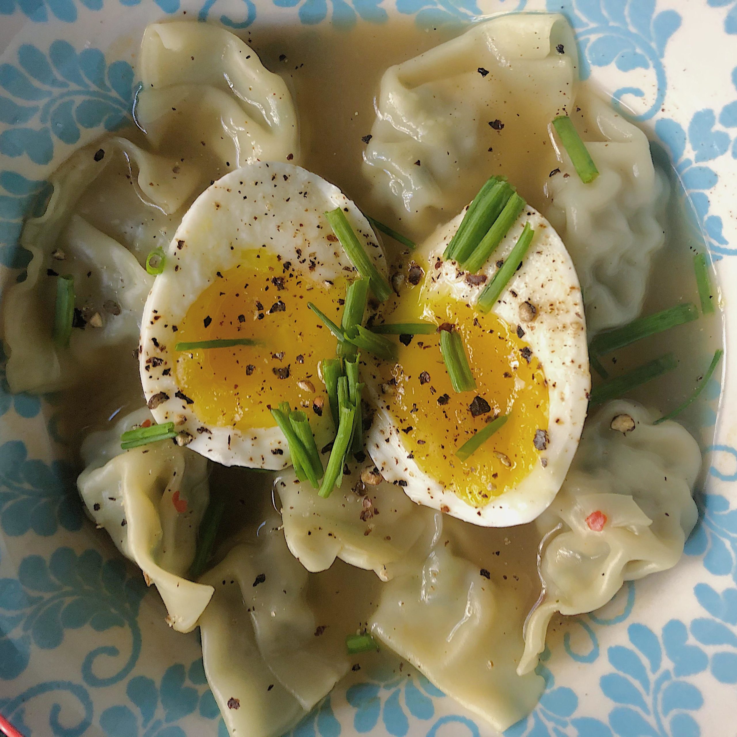 Dumpling soup with a jammy egg and chives as a midmorning snack (229