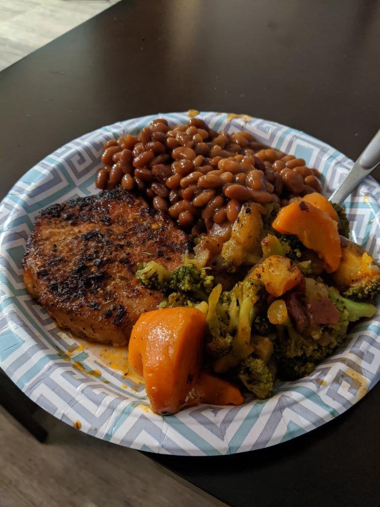 Fried pork chops with baked beans and roasted veggies. 🤤 Dining and