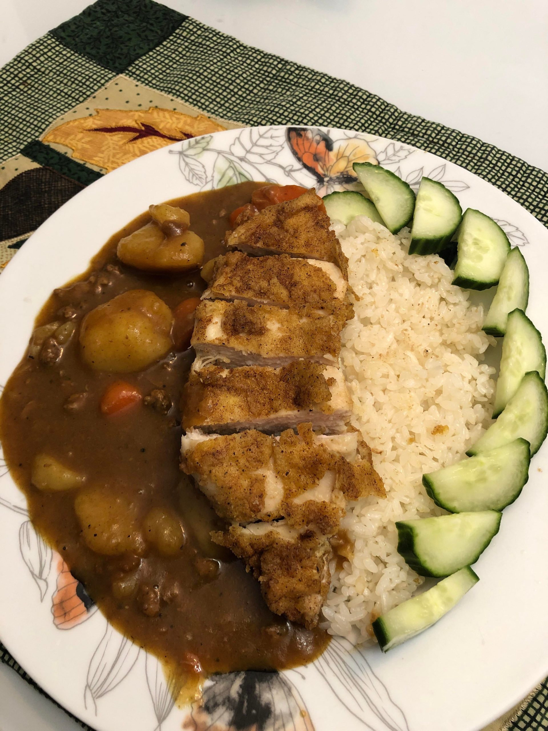 Japanese beef curry with chicken katsu rice and cucumber salad Dining
