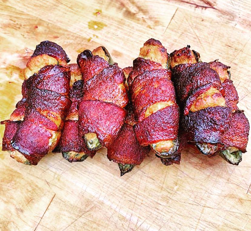 Homemade pepper crusted bacon w/ smoked goat cheese and jalapeños. Perfect snack! Dining and