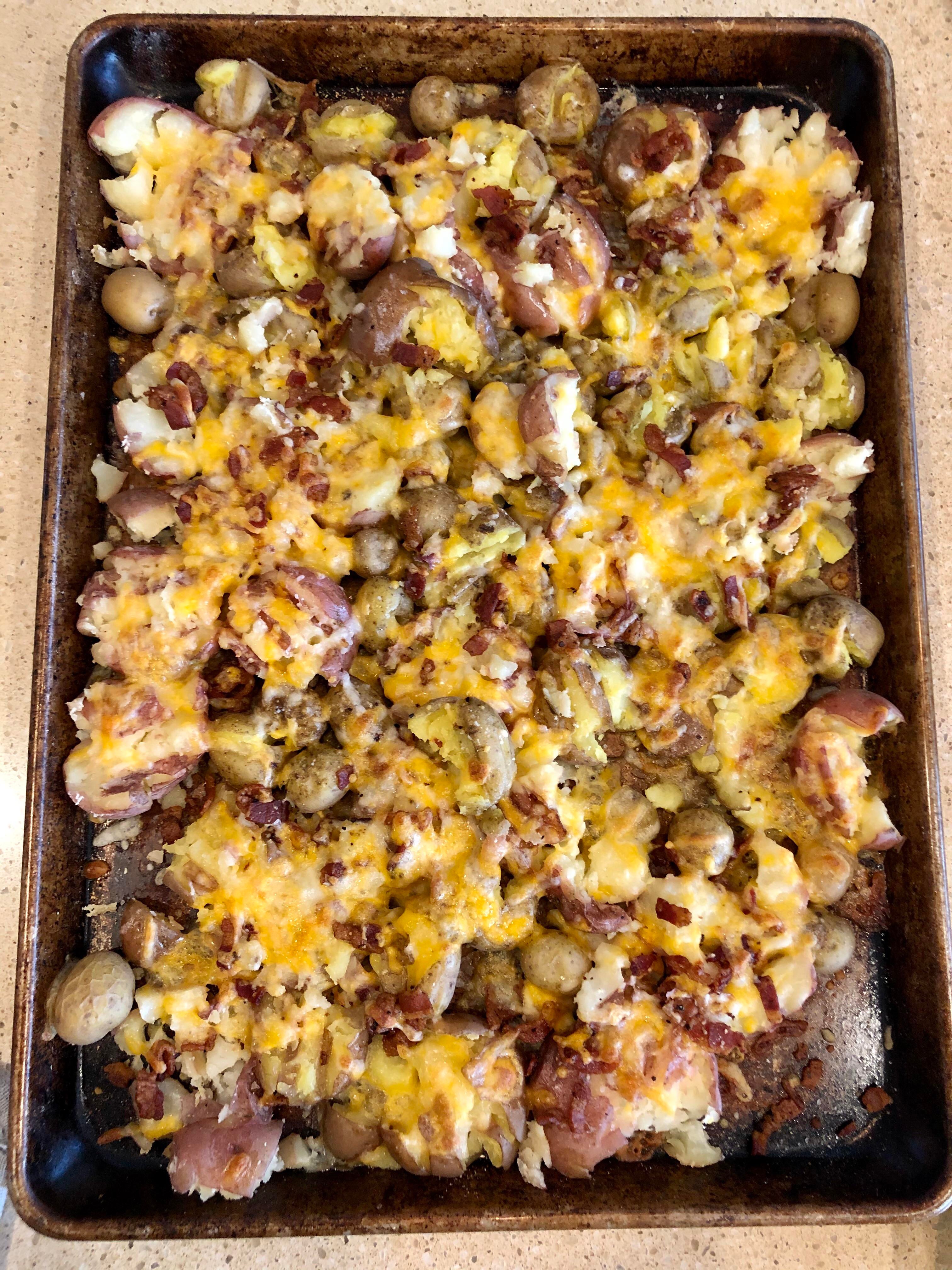 Sheet pan smashed baby potatoes with cheese and bacon. Dining and Cooking