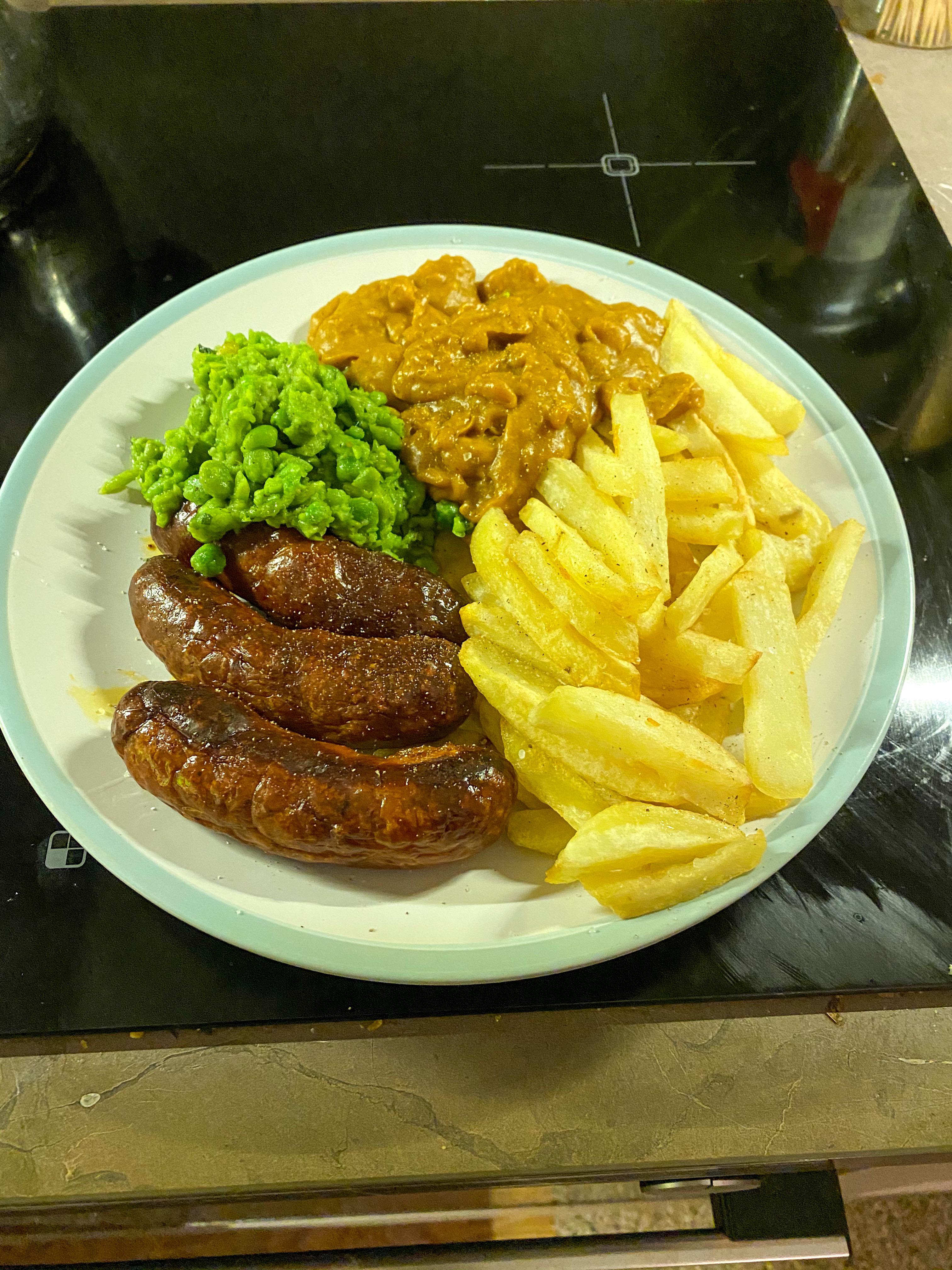 Proper chip shop style chips, mushy peas, curry sauce and sausages