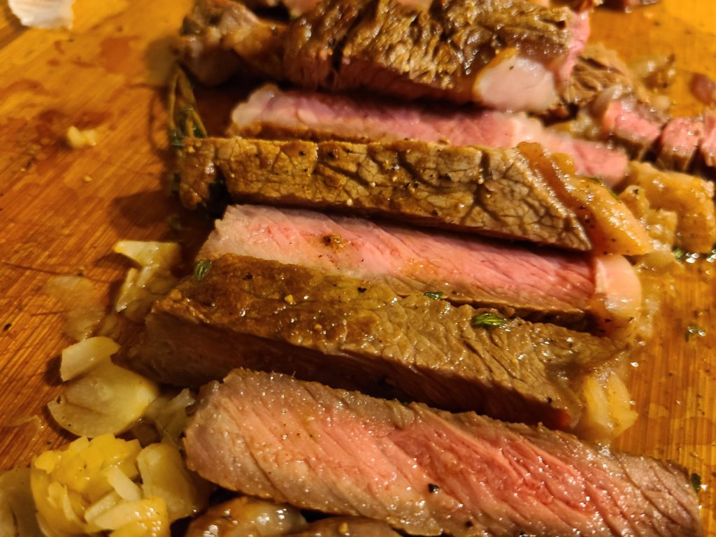 I like chopping up the garlic cooked with the steak and get garlic in every bite.