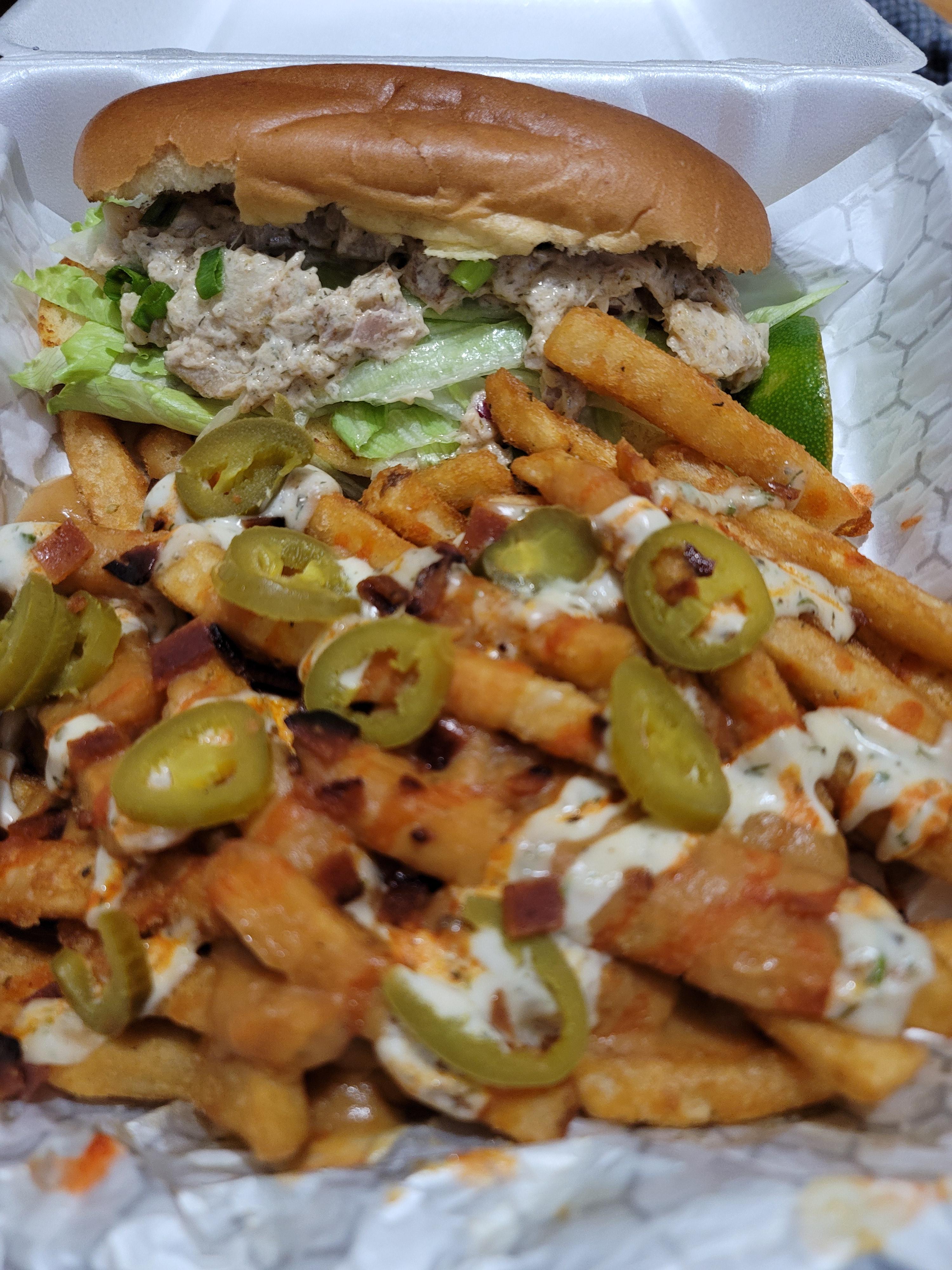 "Lobster" roll and loaded fries from my favorite food truck. Dining