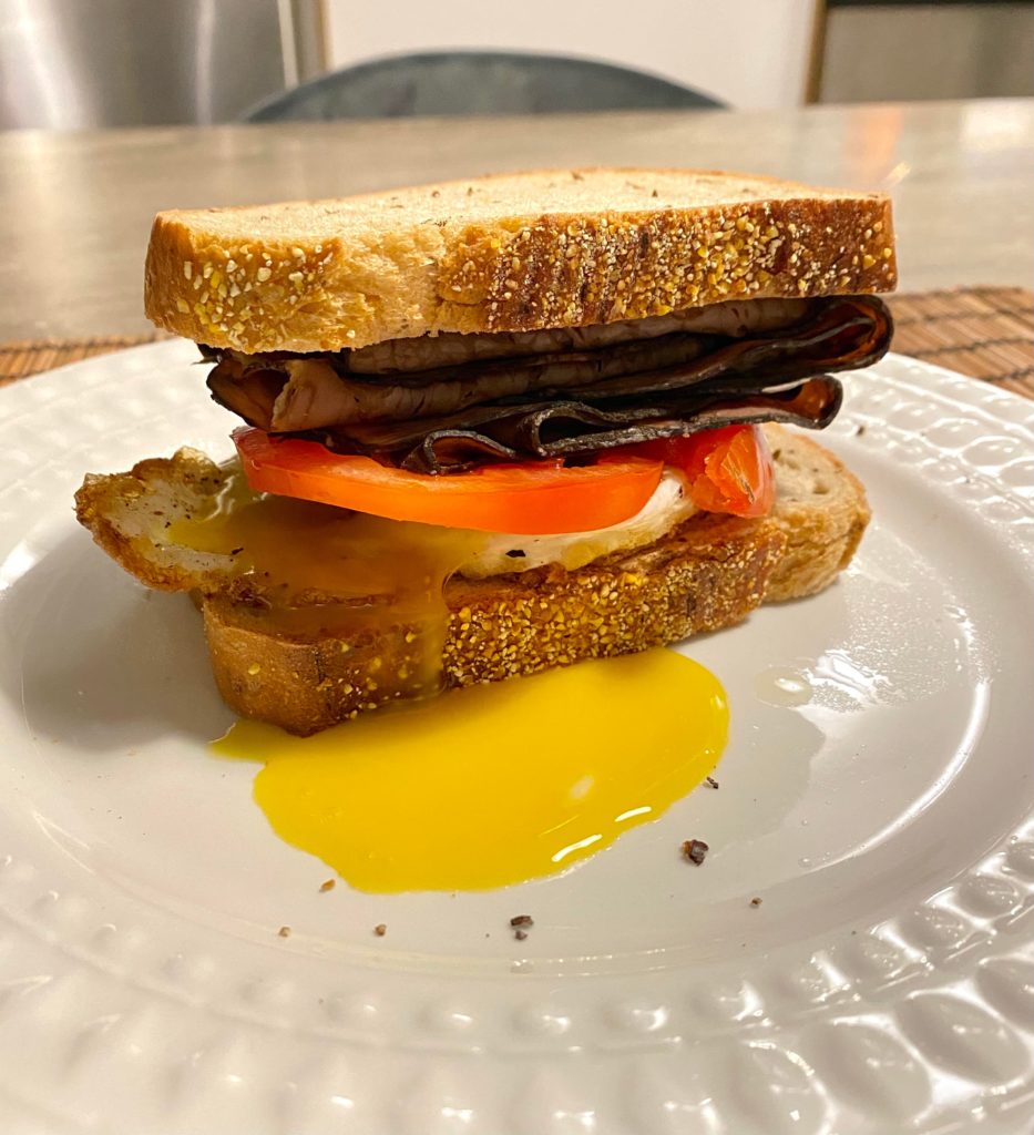 Homemade roast beef sandwich with tomatoes and an egg!