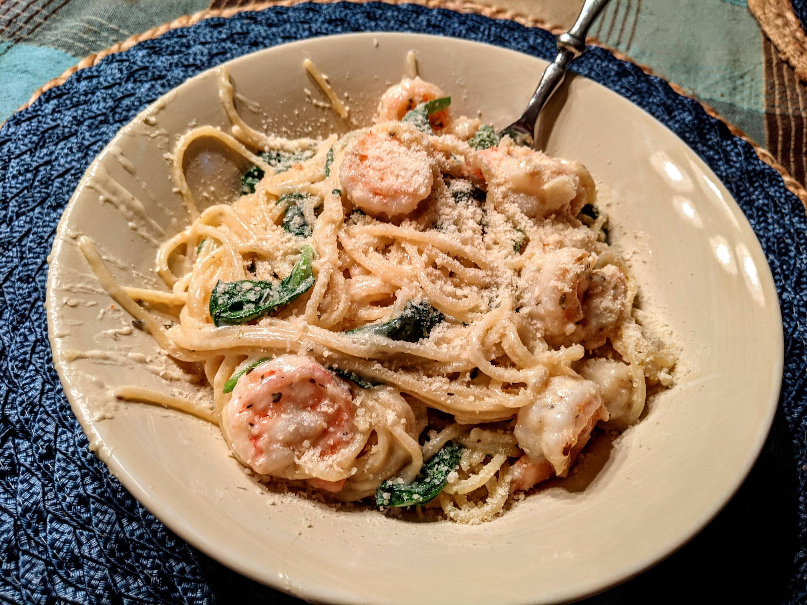 Shrimp and bay scallop pasta in a garlic and white wine cream sauce ...