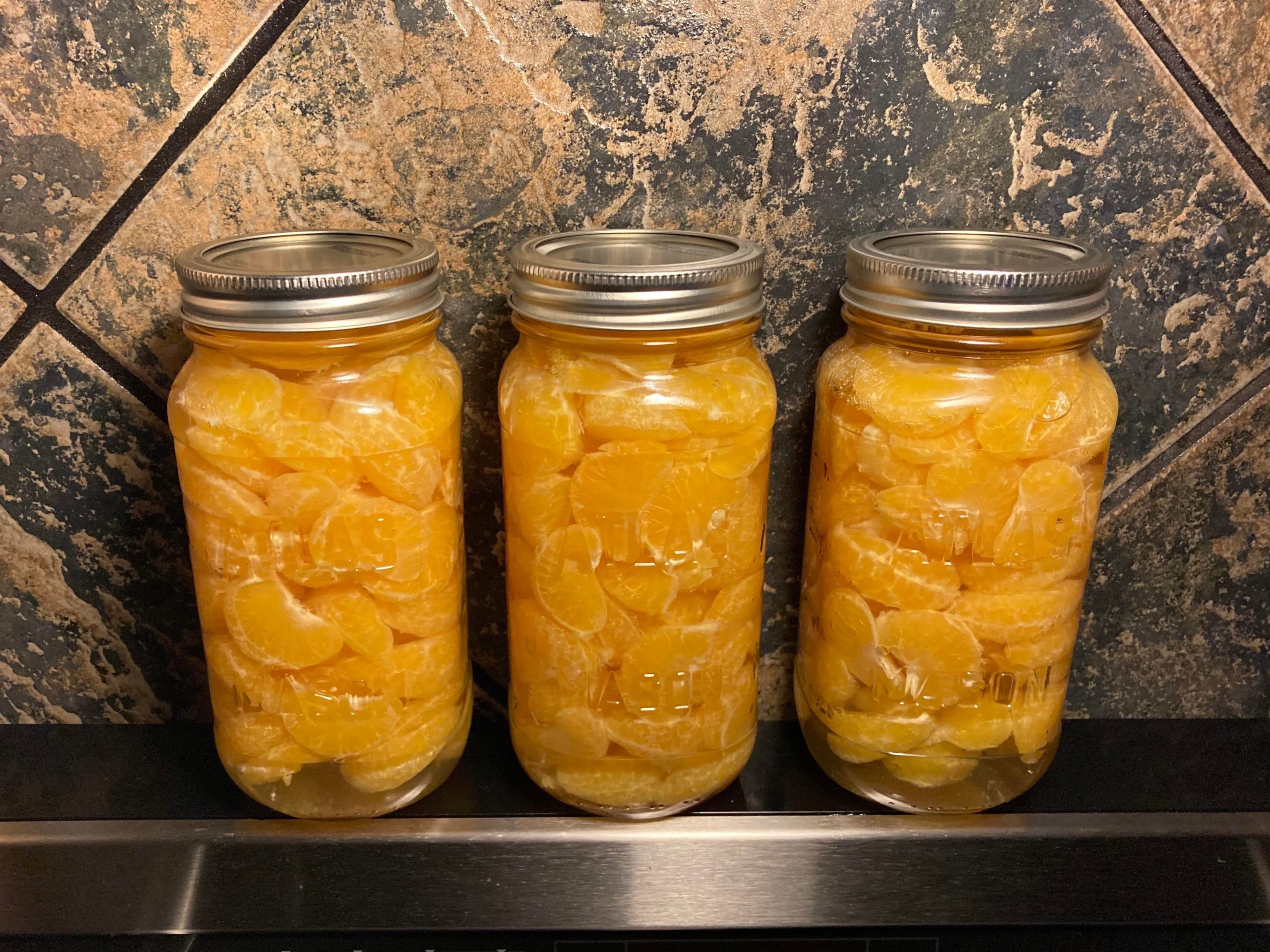 A 5lb box of mandarin oranges fits in 3 Classico pasta sauce jars