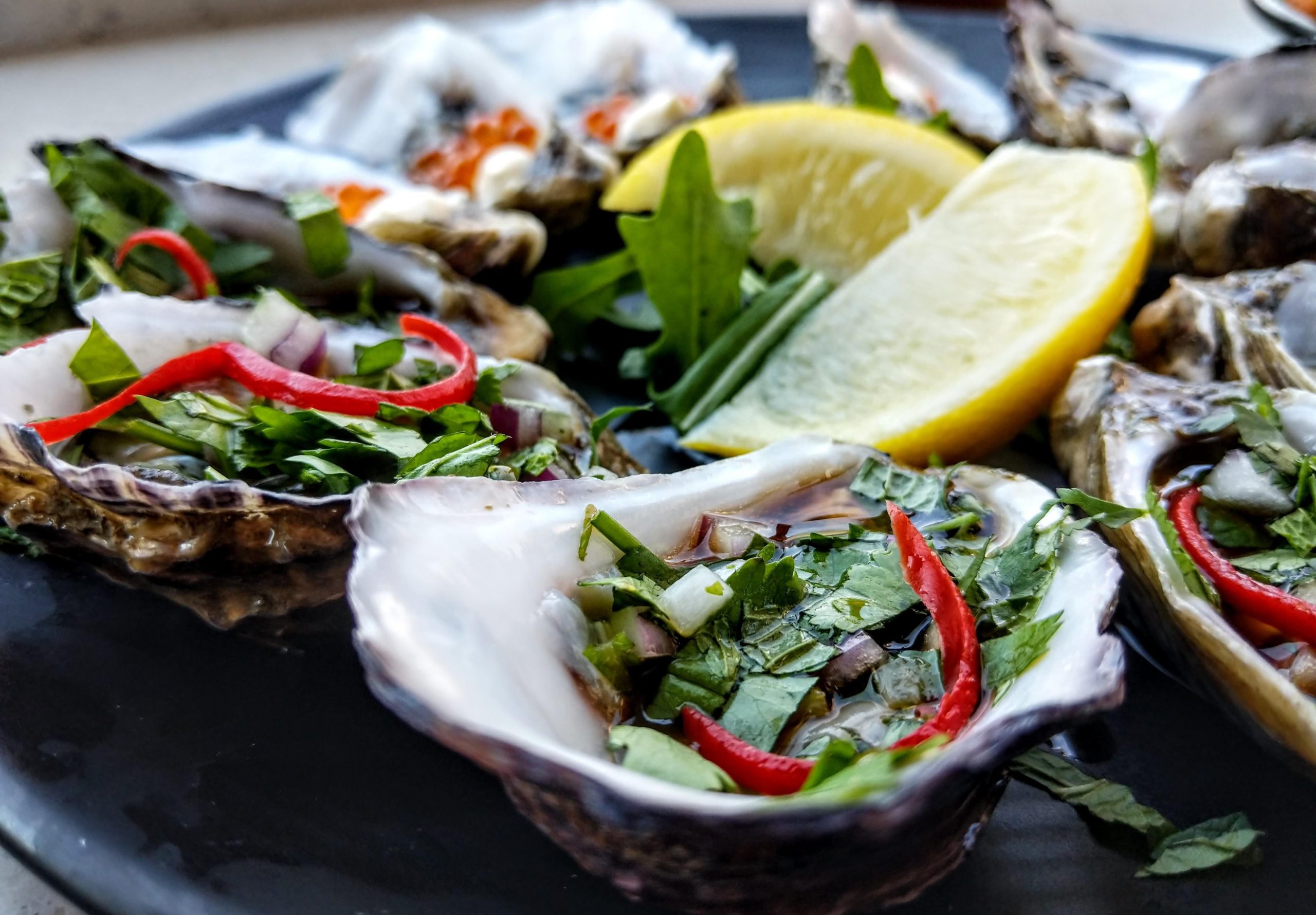 Oysters Thai style. Chilli, coriander and fish sauce. (got a couple