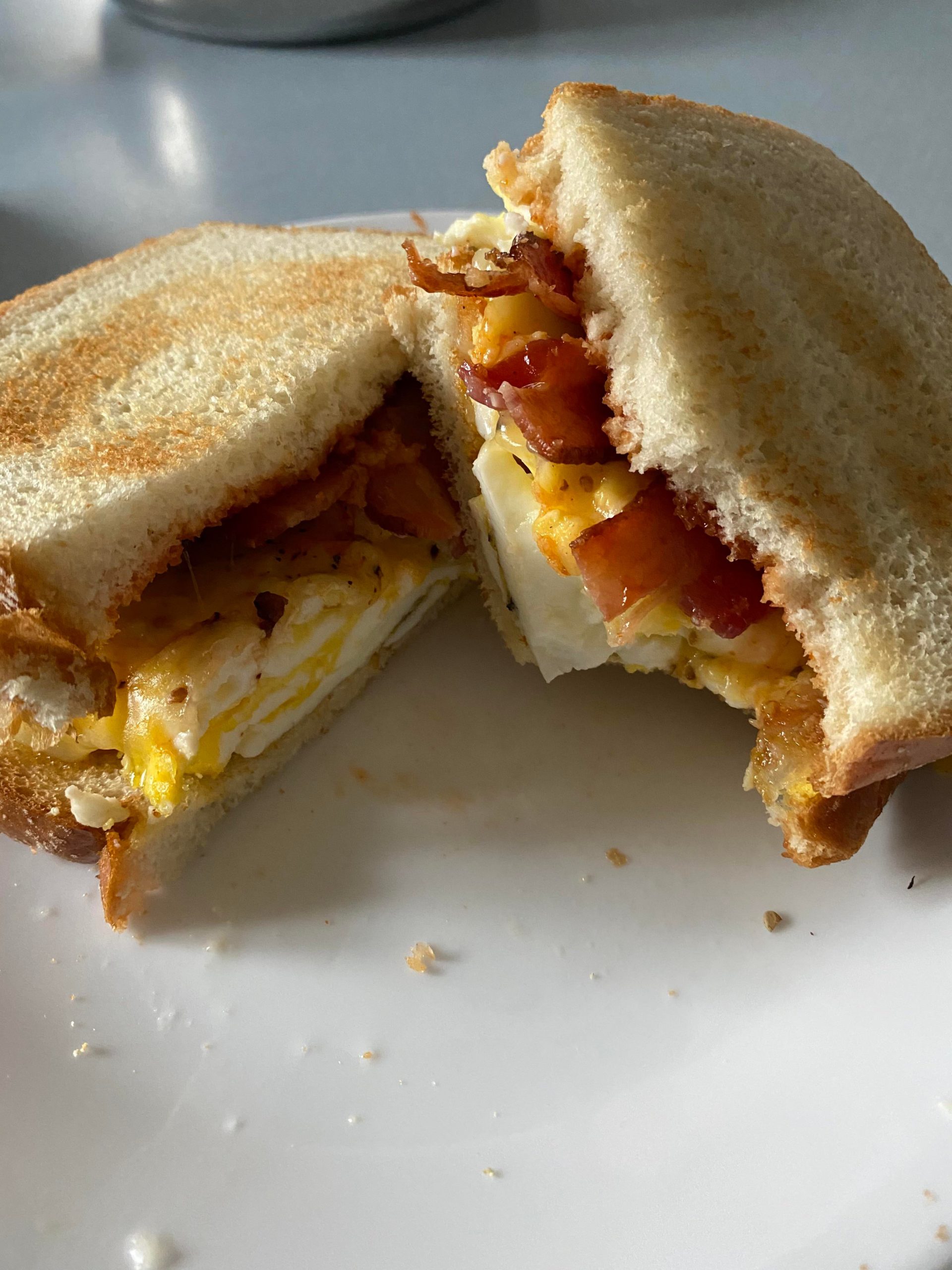 Bacon, egg and cheese, hot sauce/ketchup mix on toast Dining and Cooking