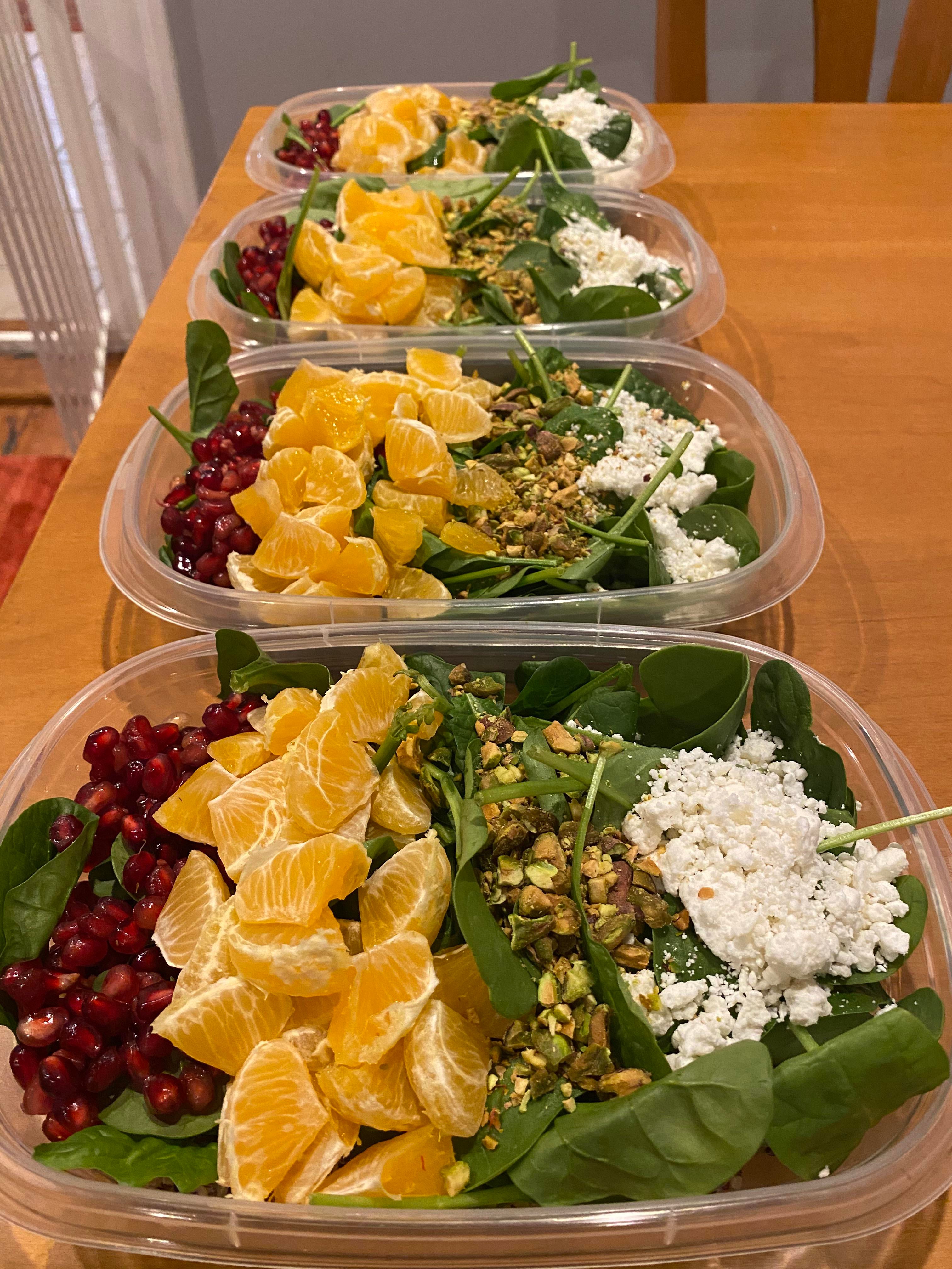 Quinoa and Spinach Salad with Pom Seeds, Mandarin Oranges, Chopped