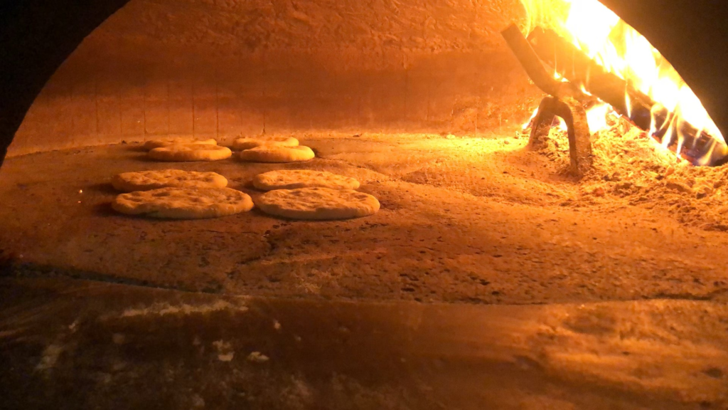 Pitot (plural for pita) rising in the oven!