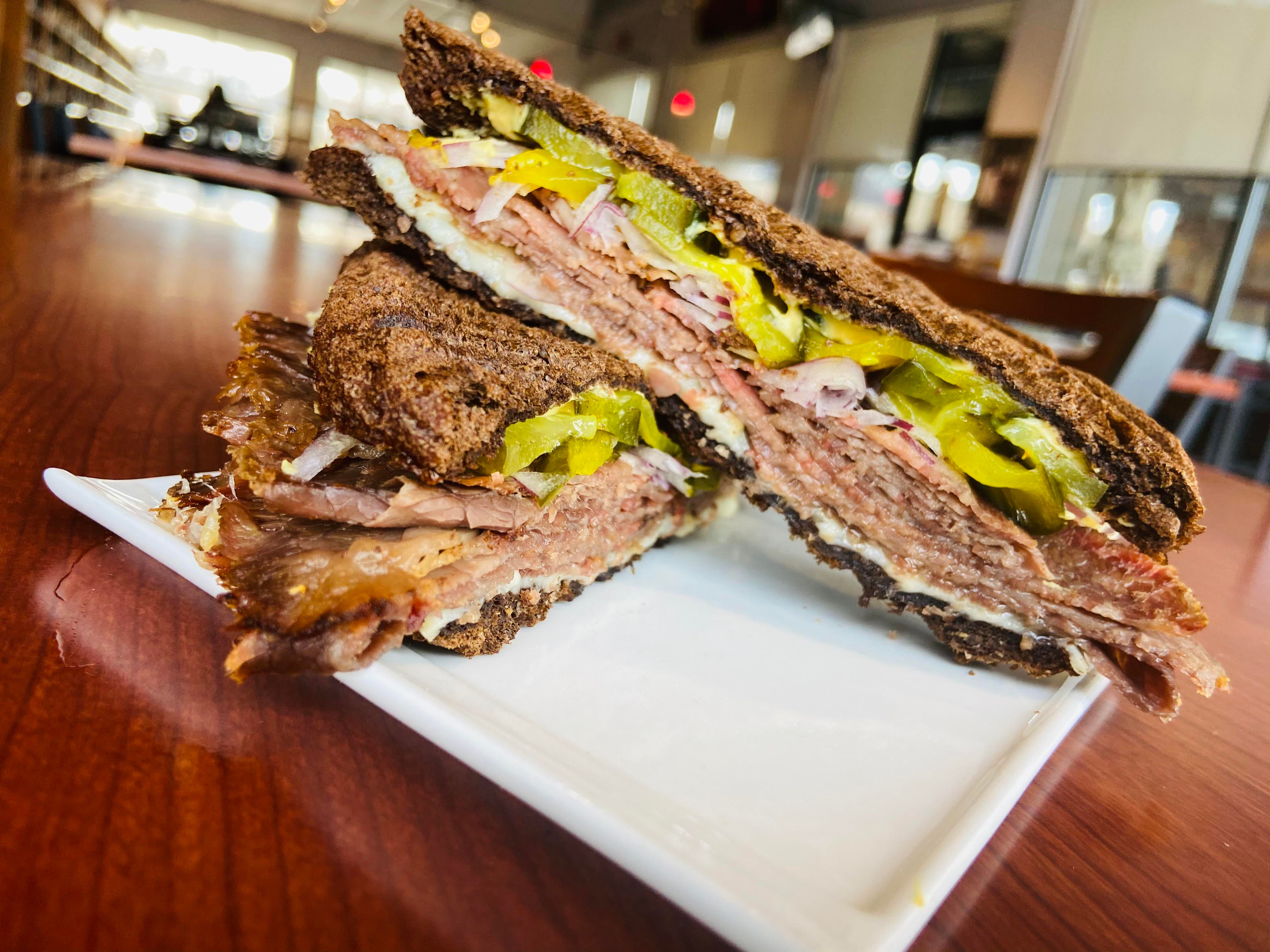 Pastrami, gruyere, house pickle, onion, Russian rye, Dijon. Dining