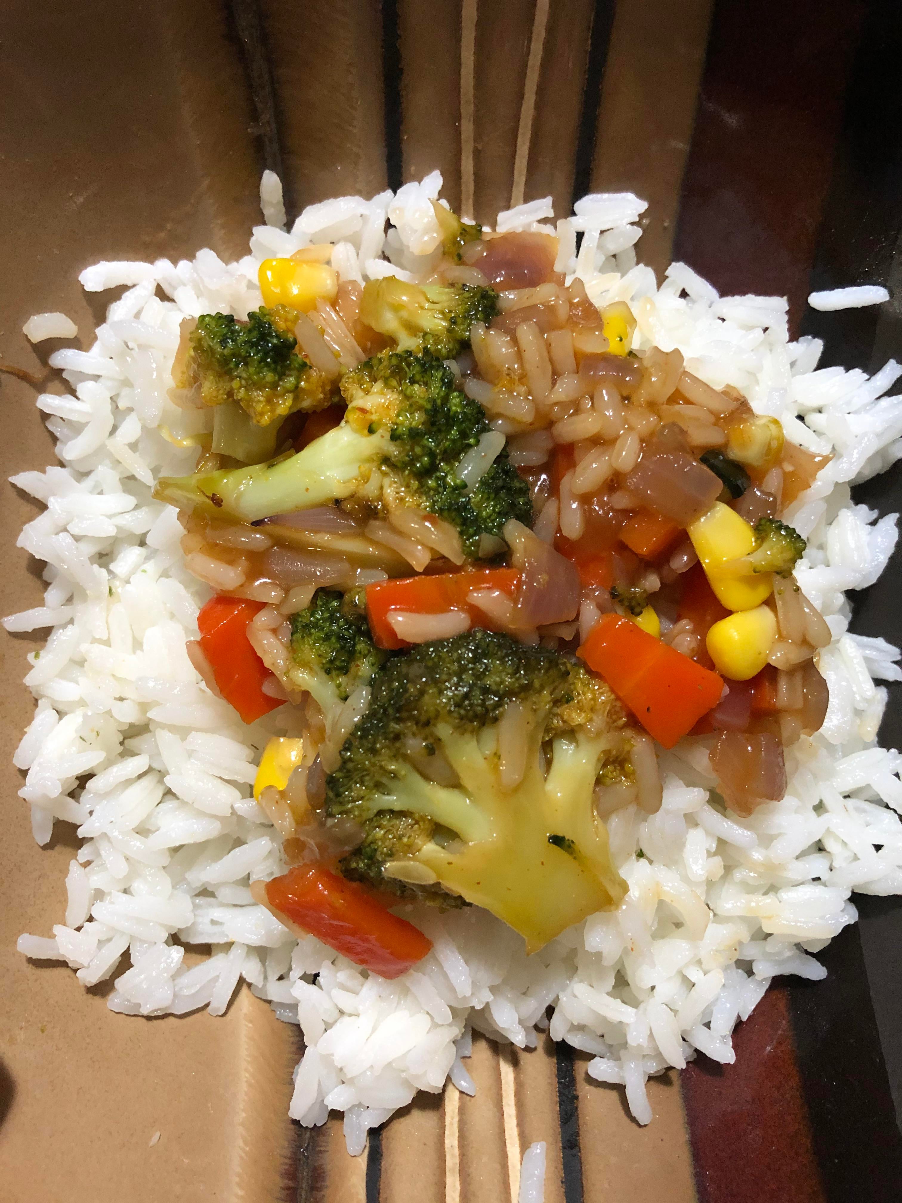 veggie stir-fry with thai sauce topped on white rice - Dining and Cooking