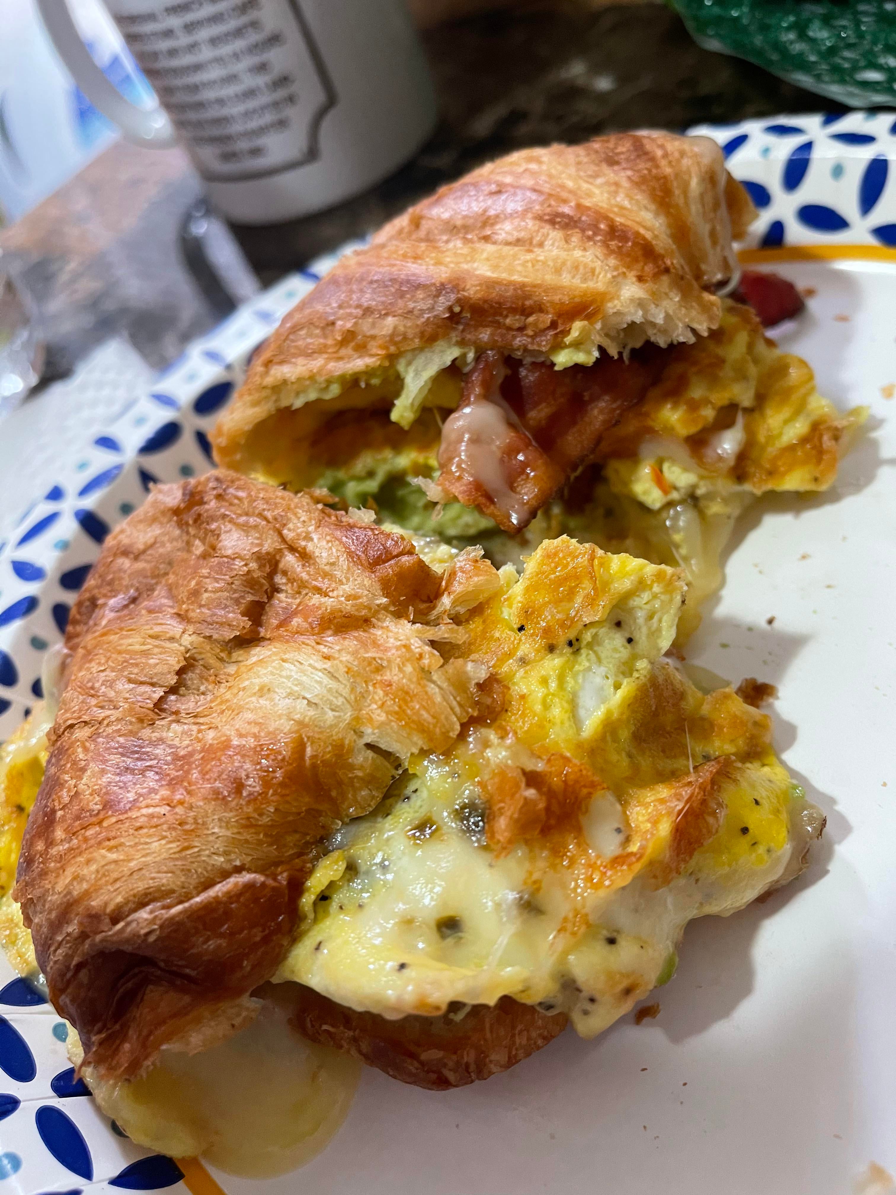 Bacon, egg and jalapeño cheddar cheese (and avocado) on a croissant Dining and Cooking