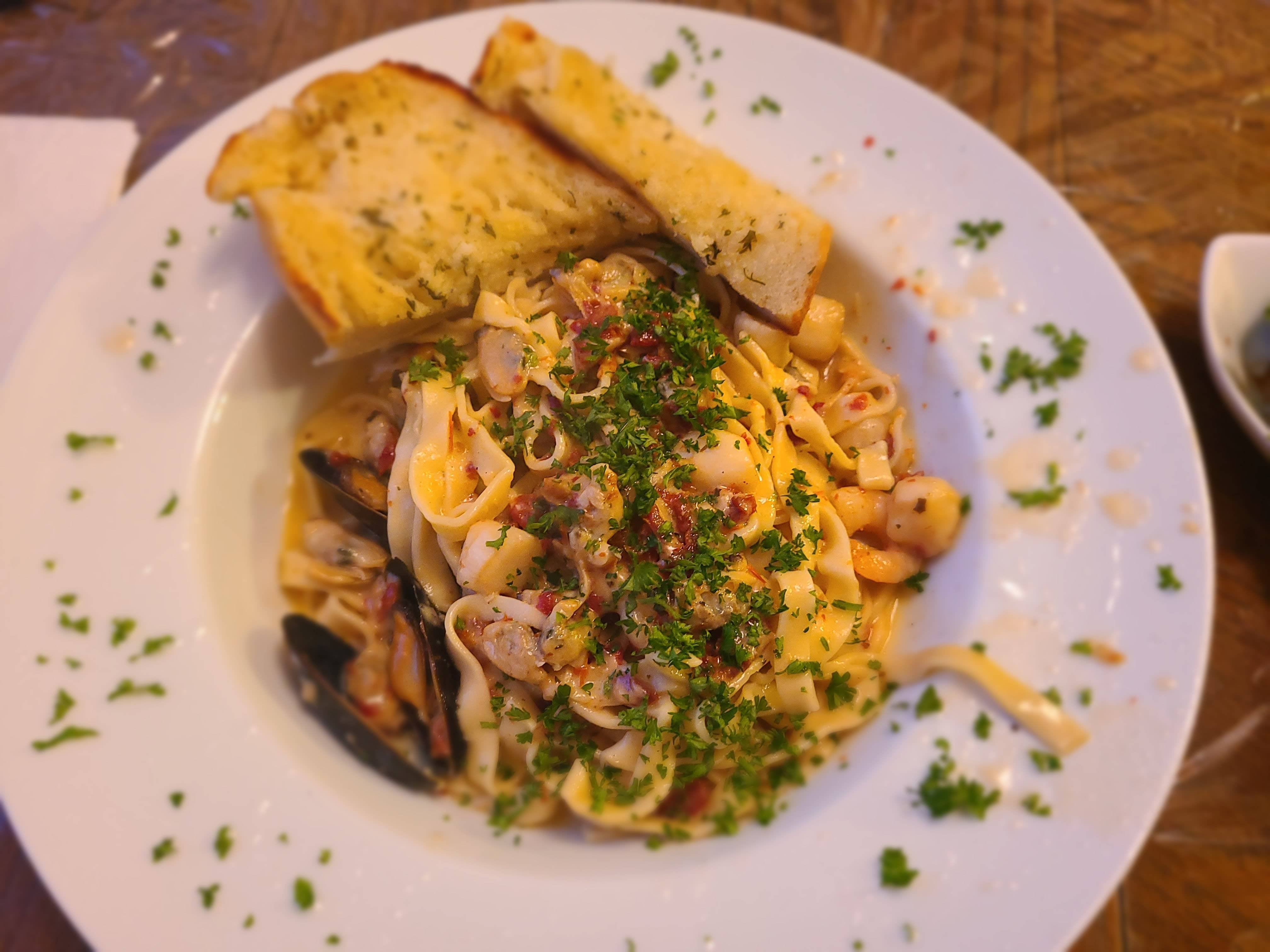 Fettuccini in a white wine and garlic butter seafood sauce. Best pasta