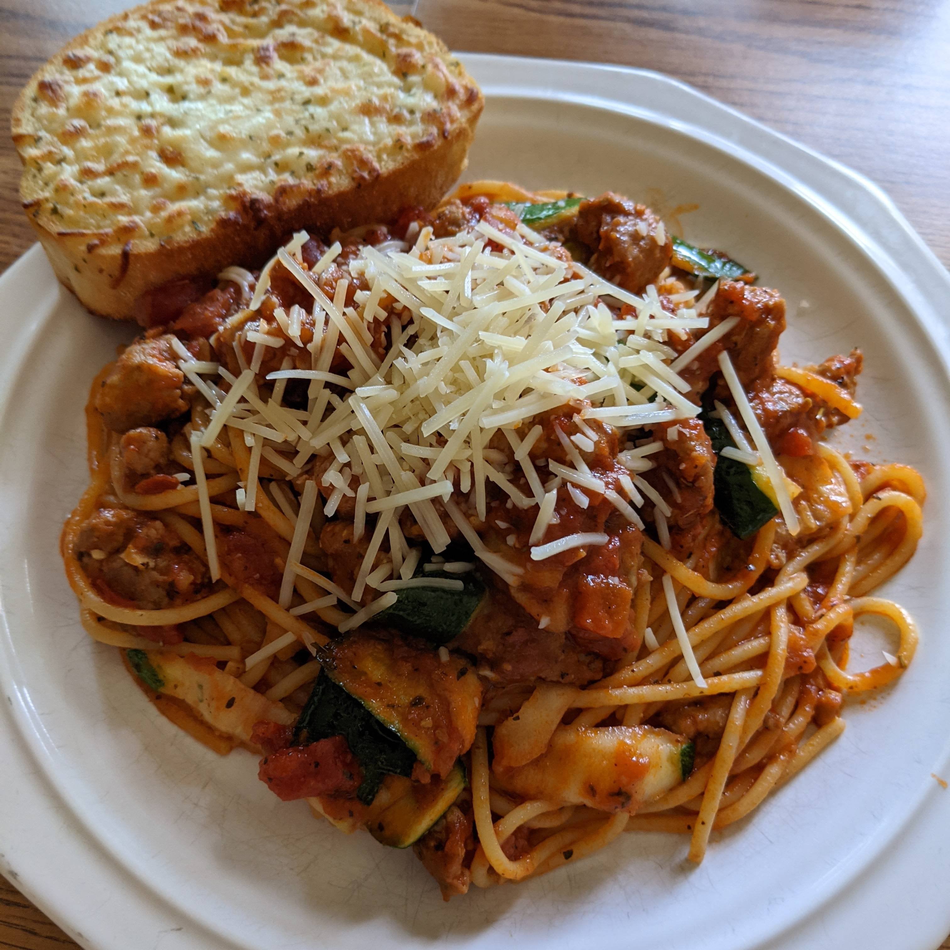 Pork sausage spaghetti bolognese with zucchini ribbons & parmesan