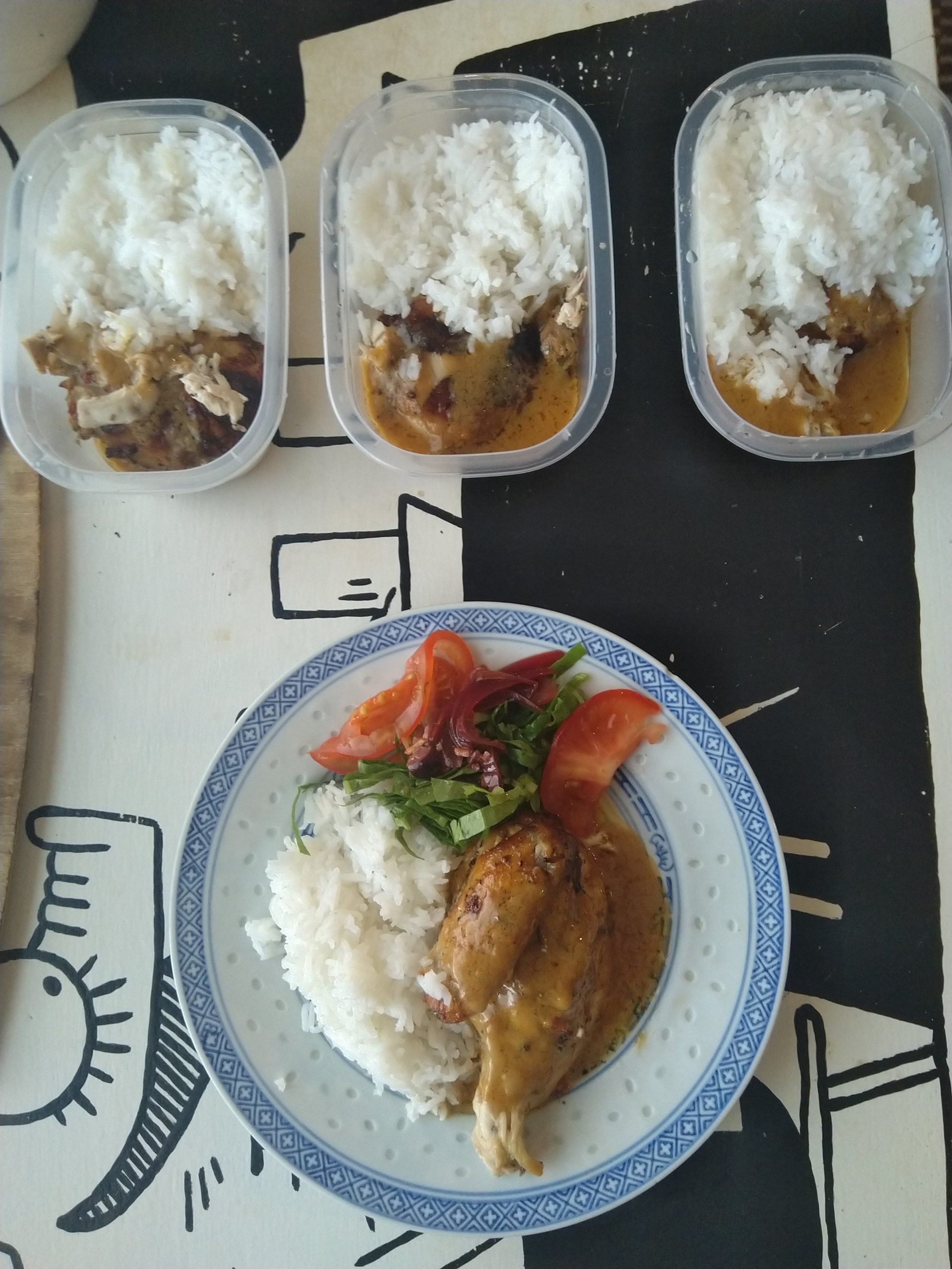 A whole chicken roasted and quartered into a mini prep with basmati