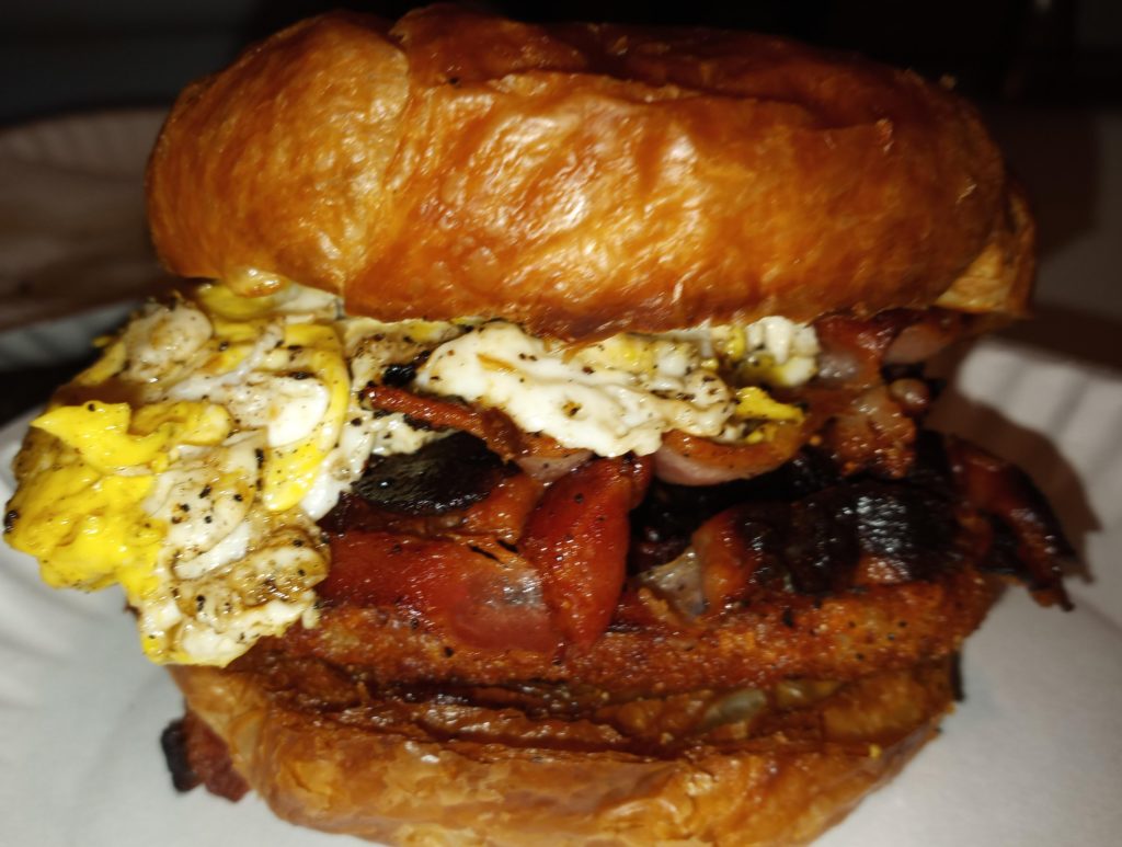 Hashbrown, crispy bacon, fried egg and cheese on a toasted croissant. 👨🏼‍🍳