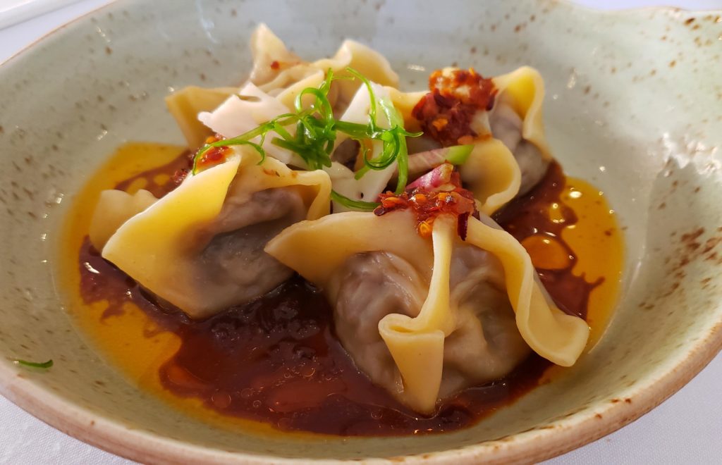 Braised Beef Short Rib Wontons - Doenjang Miso-Cola-Onion Sauce, Crispy Garlic-Chili Oil, Radish, Pickled Lotus Root
