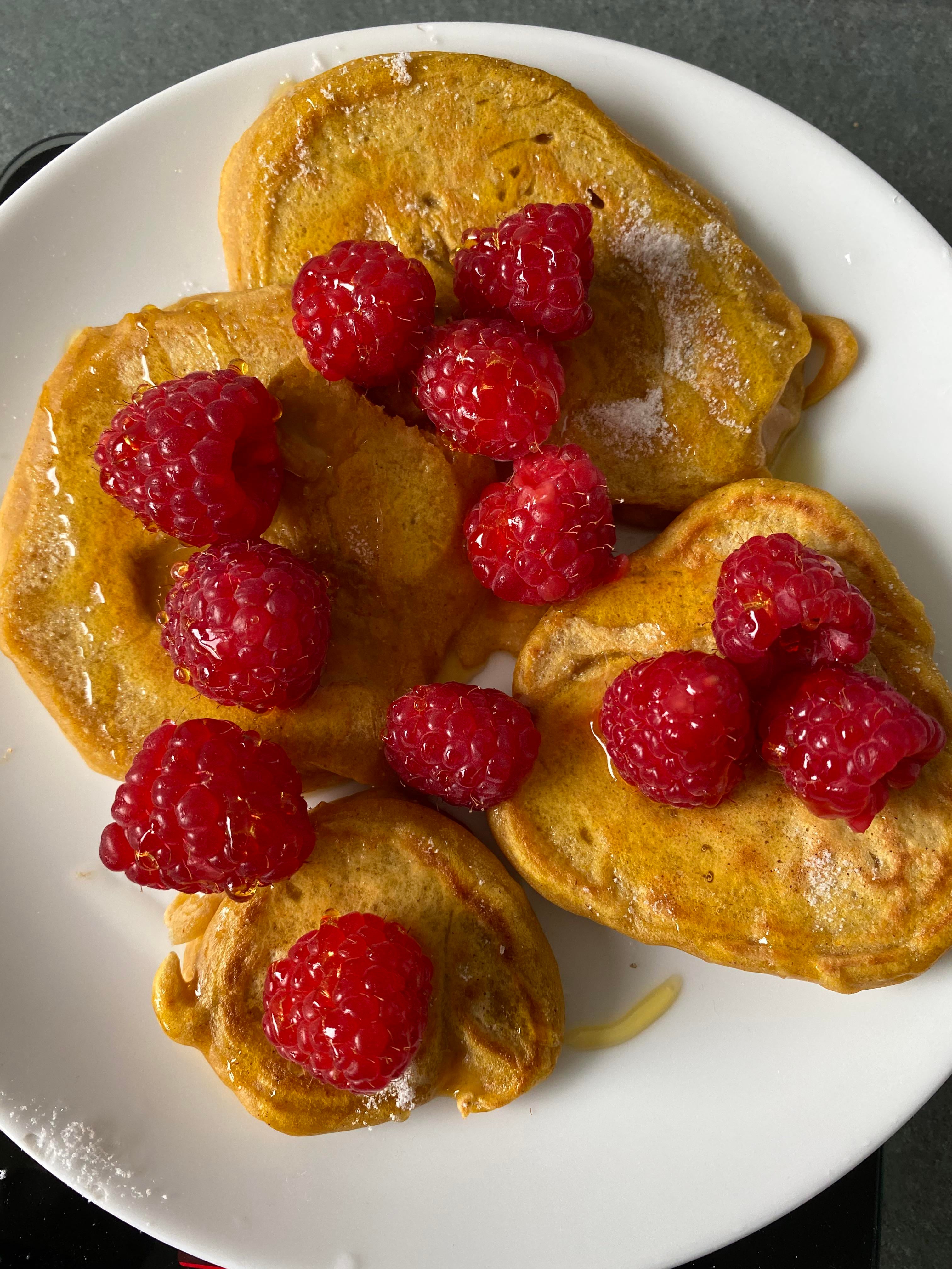 Pancakes for 309 calories without the syrup and raspberries. 413 with