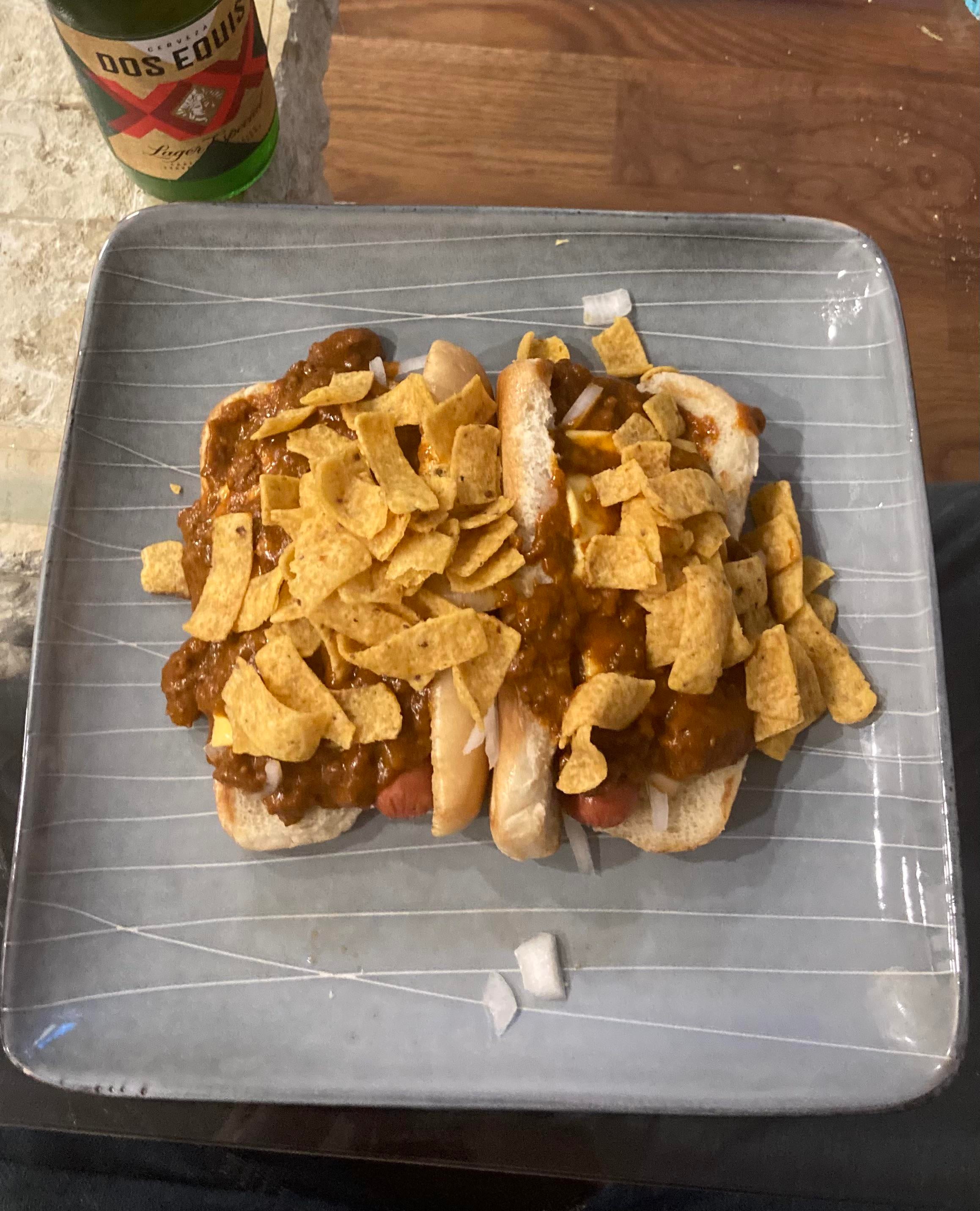 Chili Dawgs topped with Fritos and onions Dining and Cooking