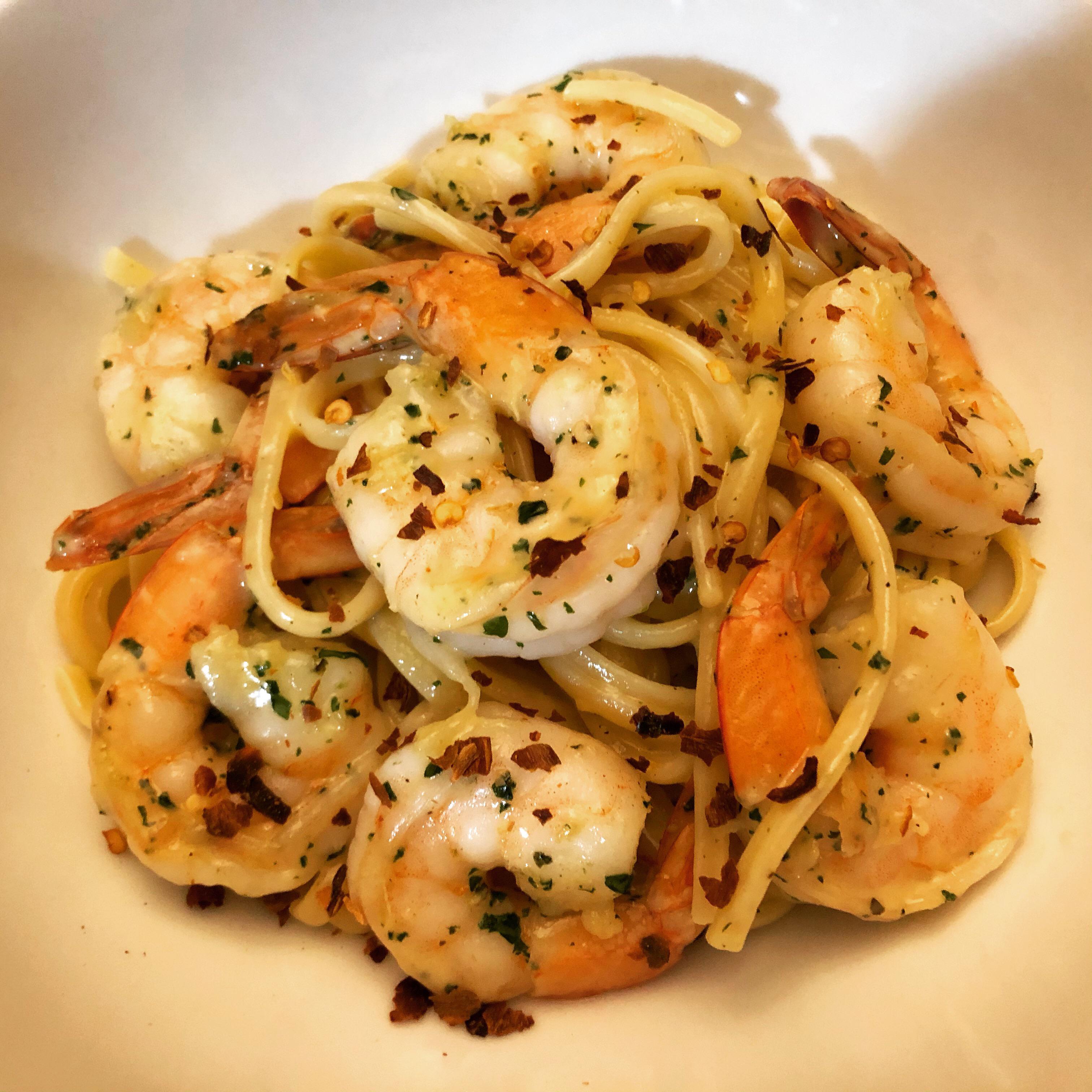 Scampi linguine arrabiatta in a light cream sauce with fresh oregano