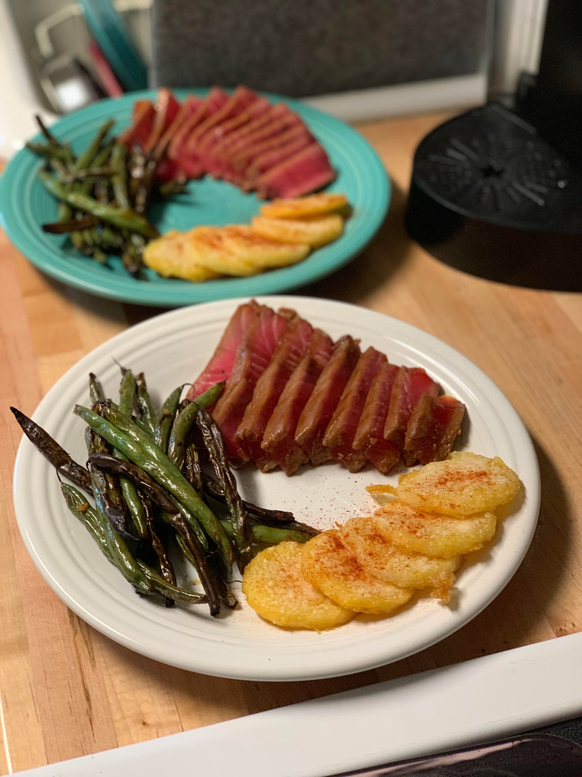 Seared ahi tuna steaks, air fried wasabi green beans, and crispy