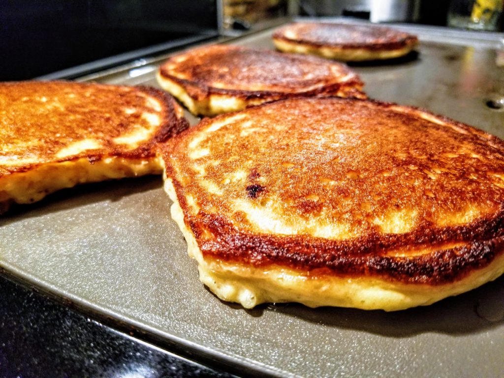 Pancakes cooked on griddle, crispy edges!
