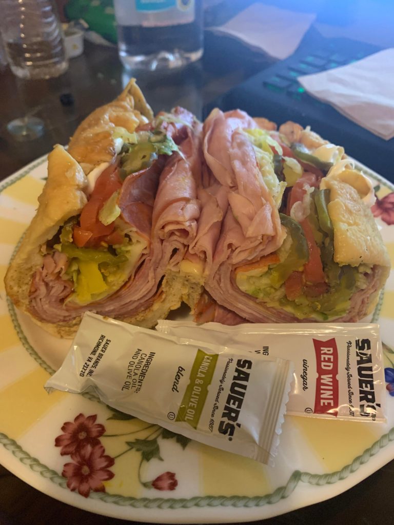 Publix Italian sub(Genoa salami, tavern ham, hot cappacolla.) Muenster cheese. Spicy mustard, yellow peppers, lettuce, garlic pickles, tomatoes. Double meat of course.