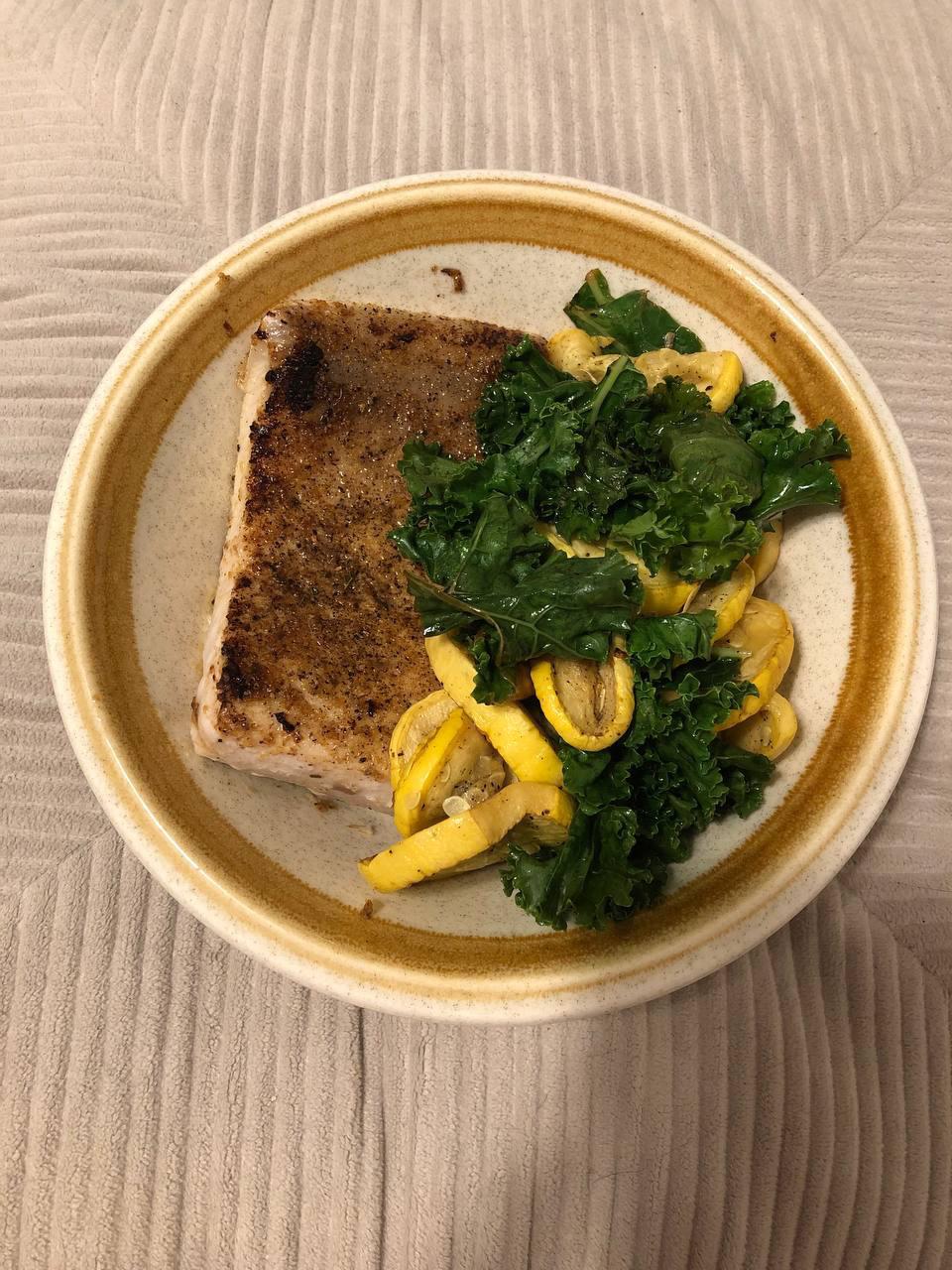 heavily seasoned yellowtail, sautéed summer squash, and steamed kale