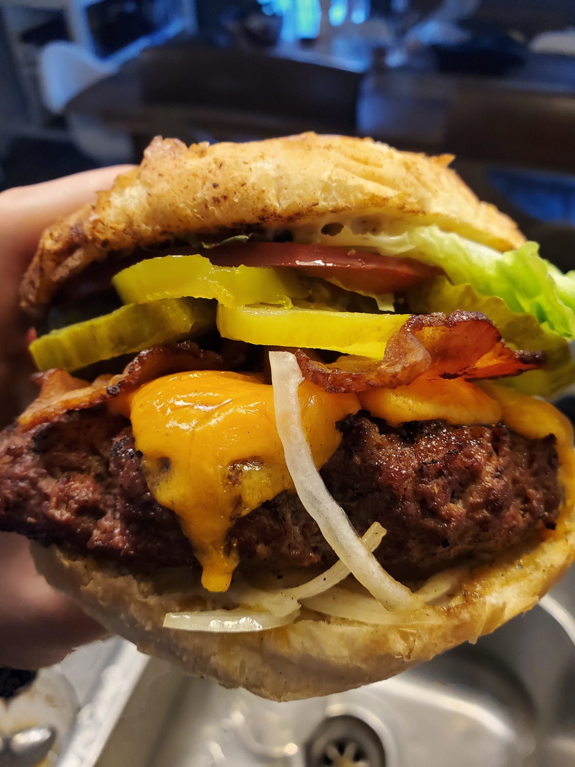 Bacon cheeseburger with dill pickles, jalapenos, heirloom tomatoe