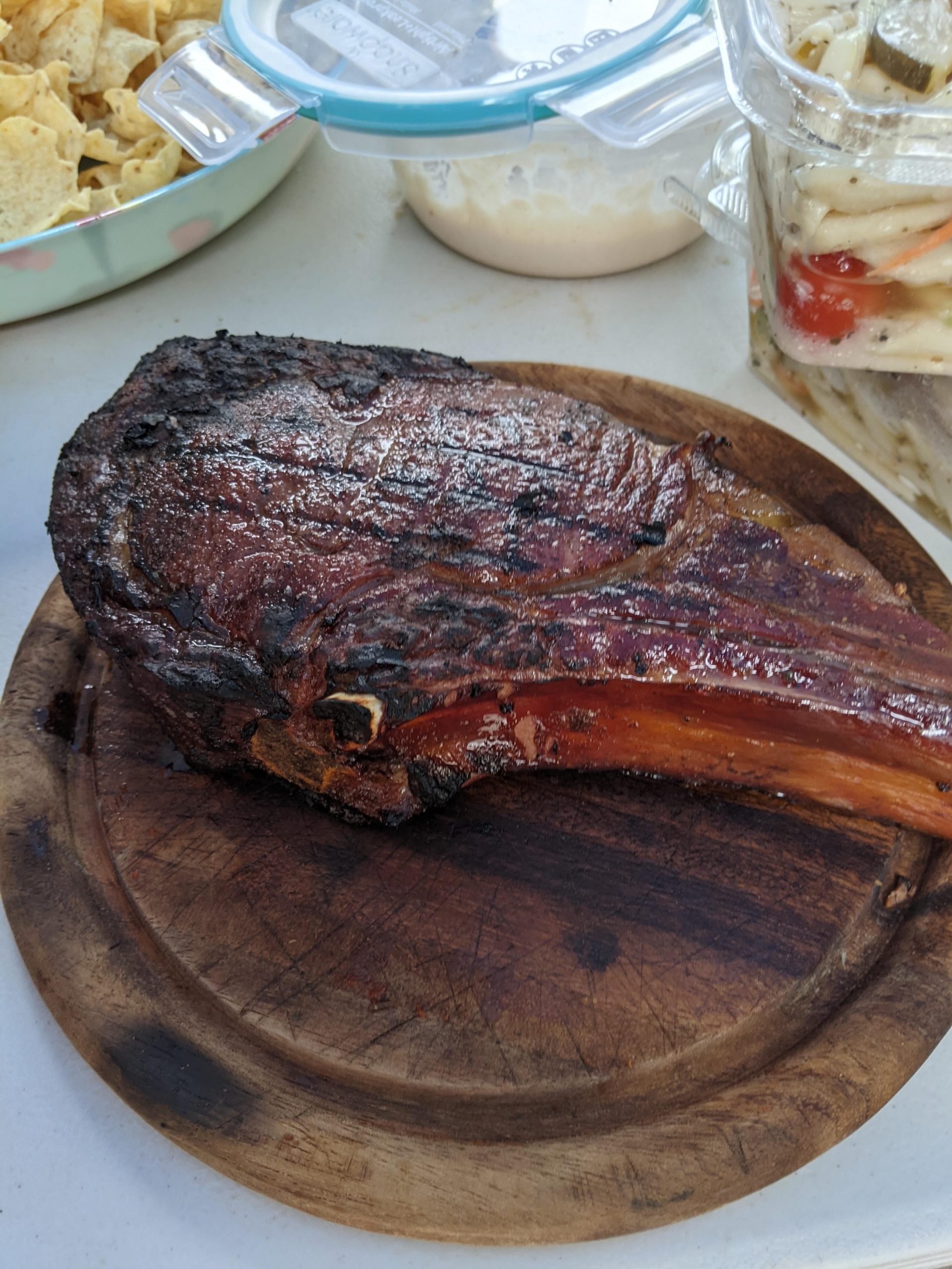 4th bone in prime ribeye, 32oz. Smoked to 130 then seared on a charcoal